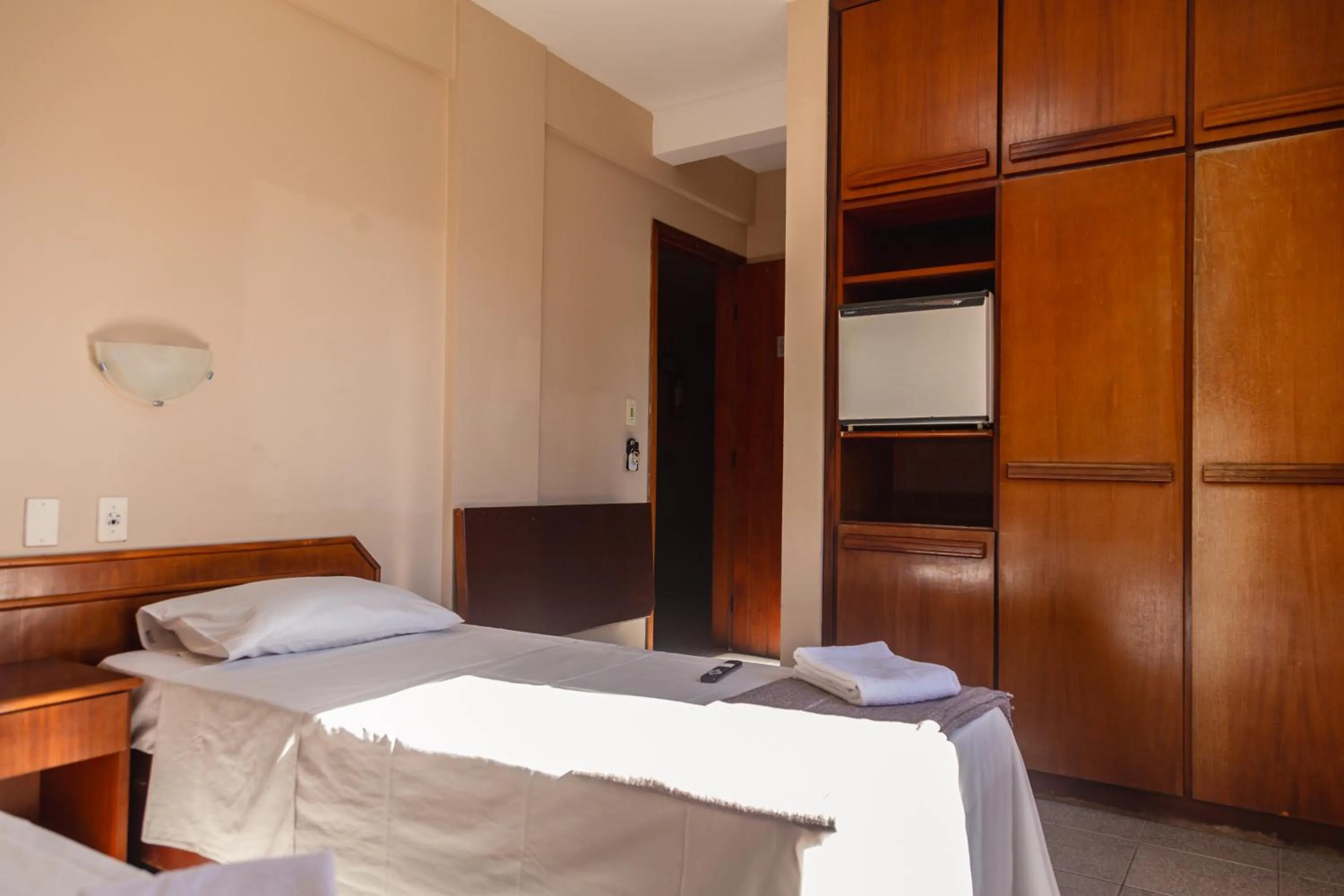 Photo of the whole room, Bed in HANNA Praia Hotel - Florianópolis