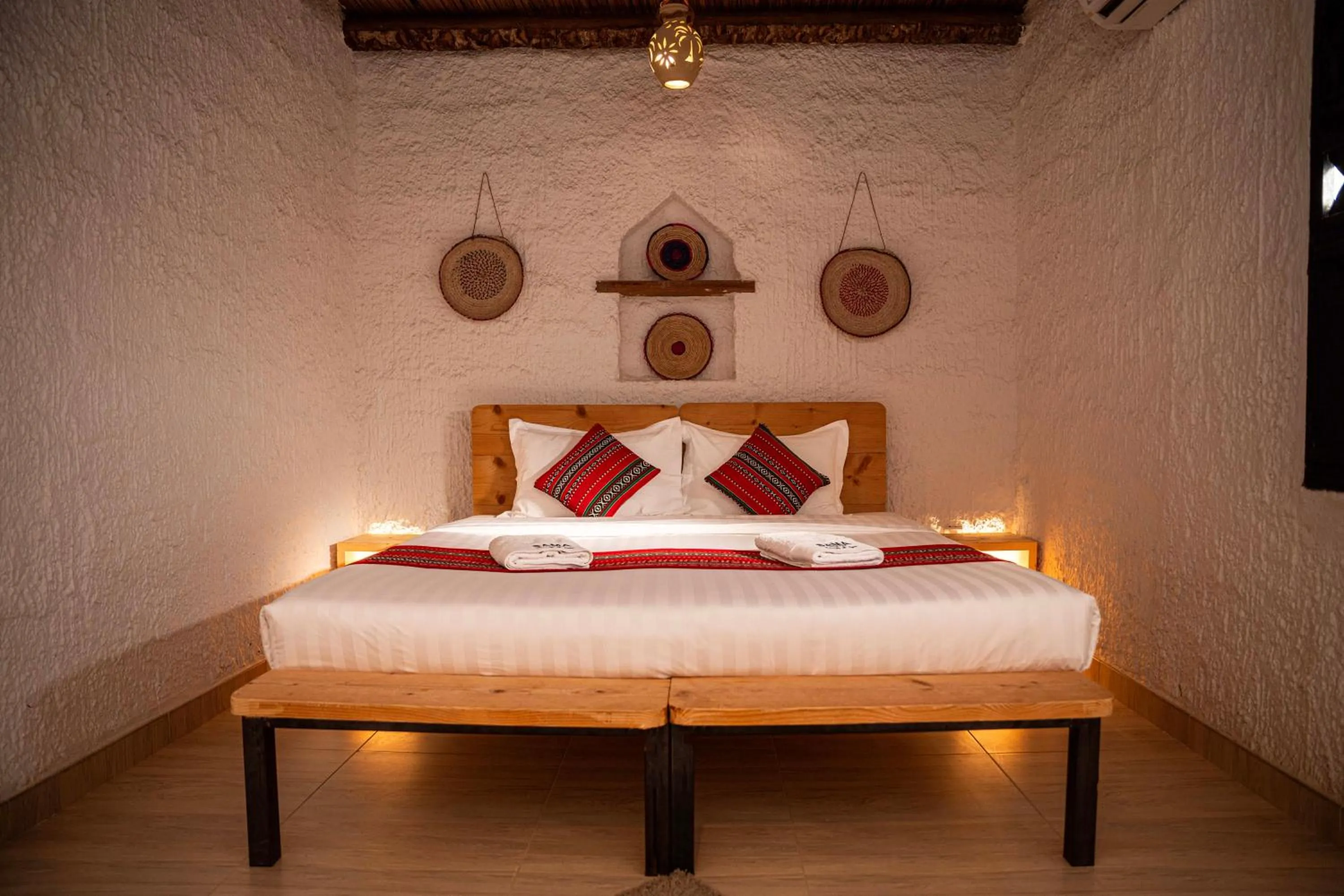 Bed in Sama al Wasil Desert Camp