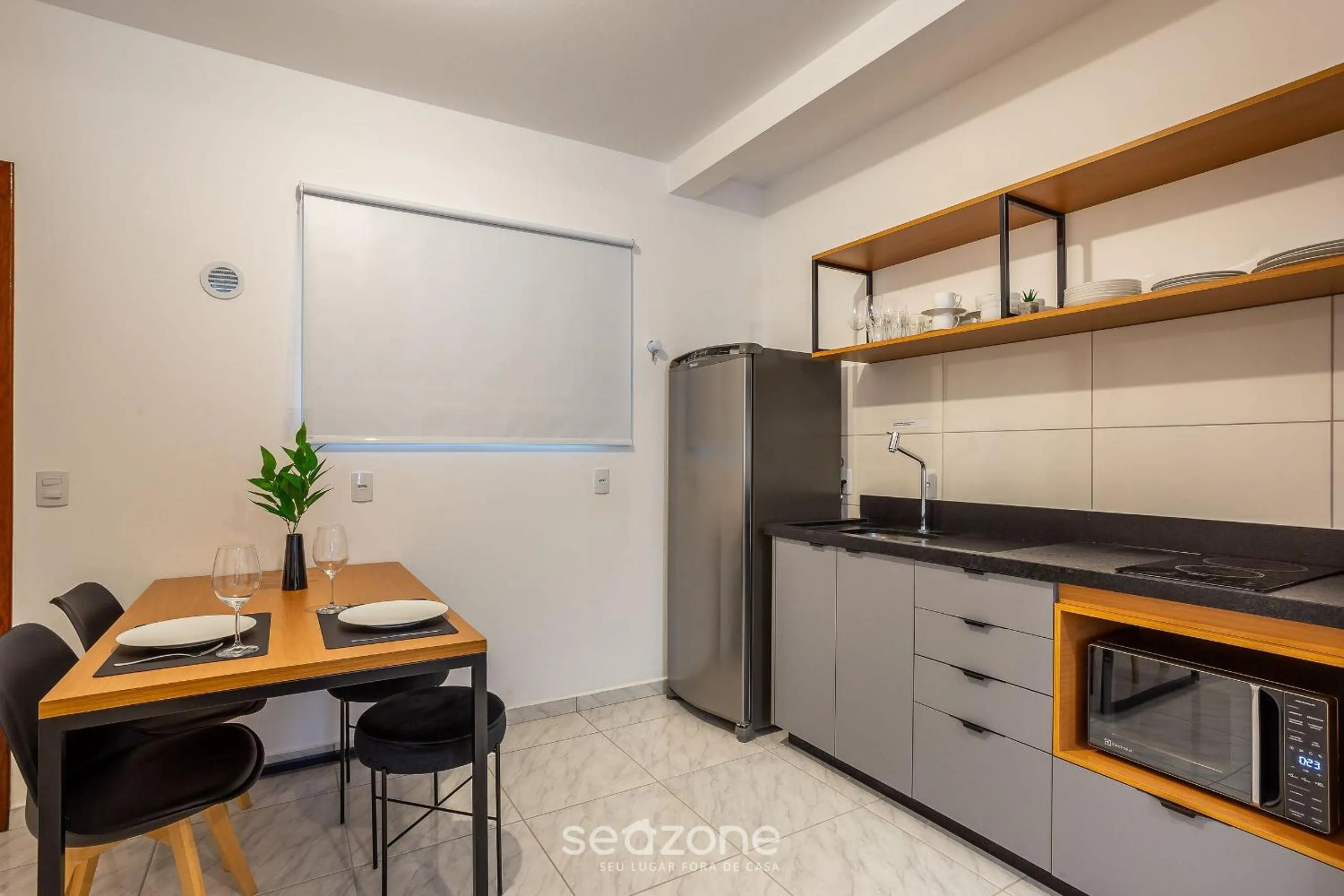 Kitchen or kitchenette in Apartamentos em Jurerê - JMA