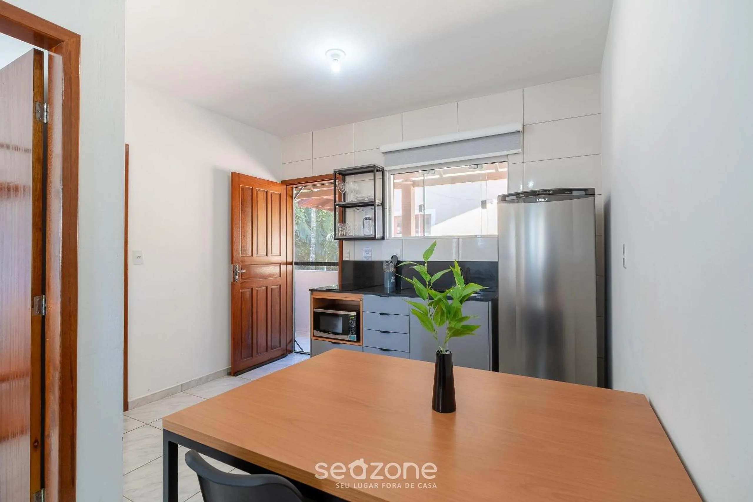 Kitchen or kitchenette in Apartamentos em Jurerê - JMA