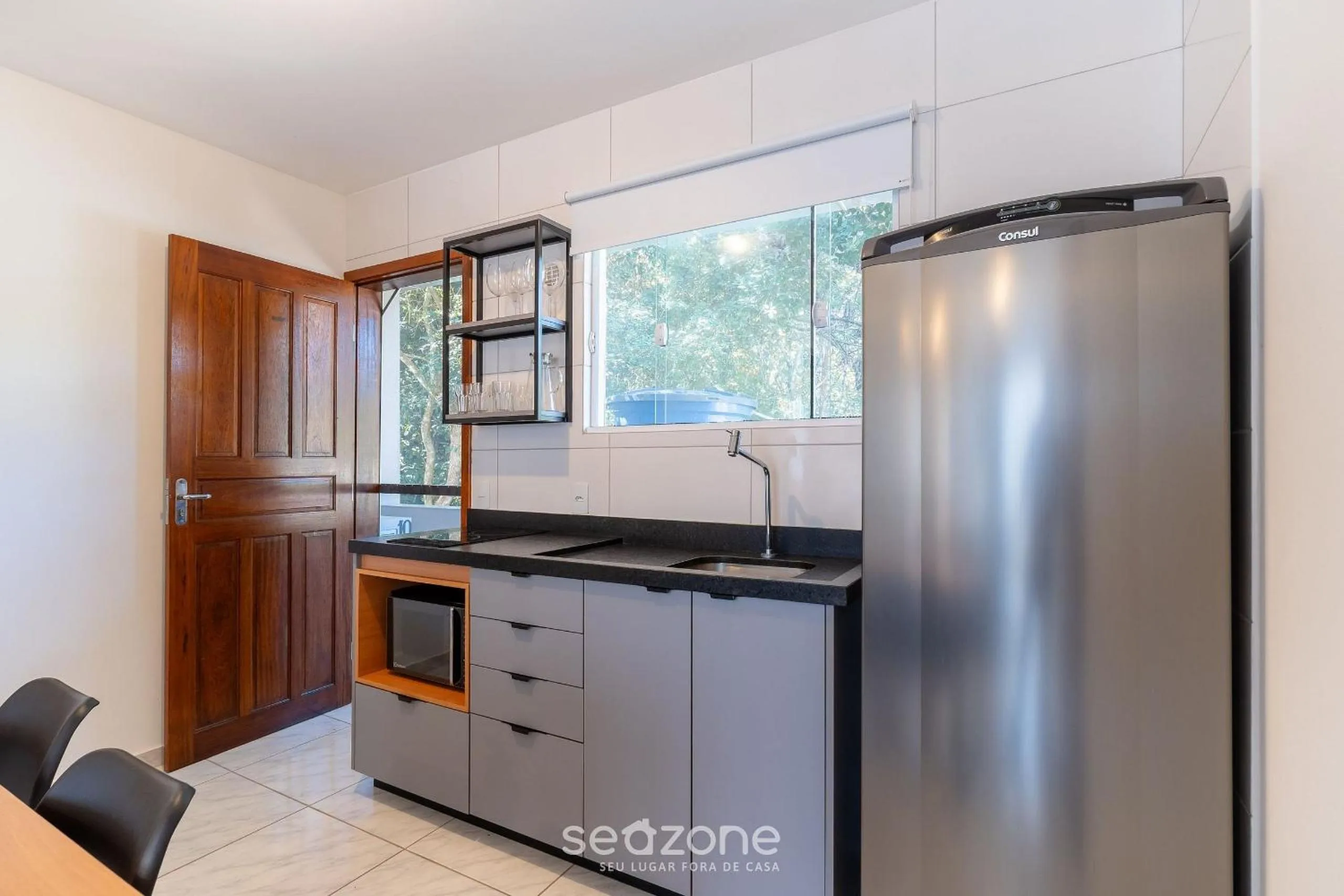 Kitchen or kitchenette in Apartamentos em Jurerê - JMA