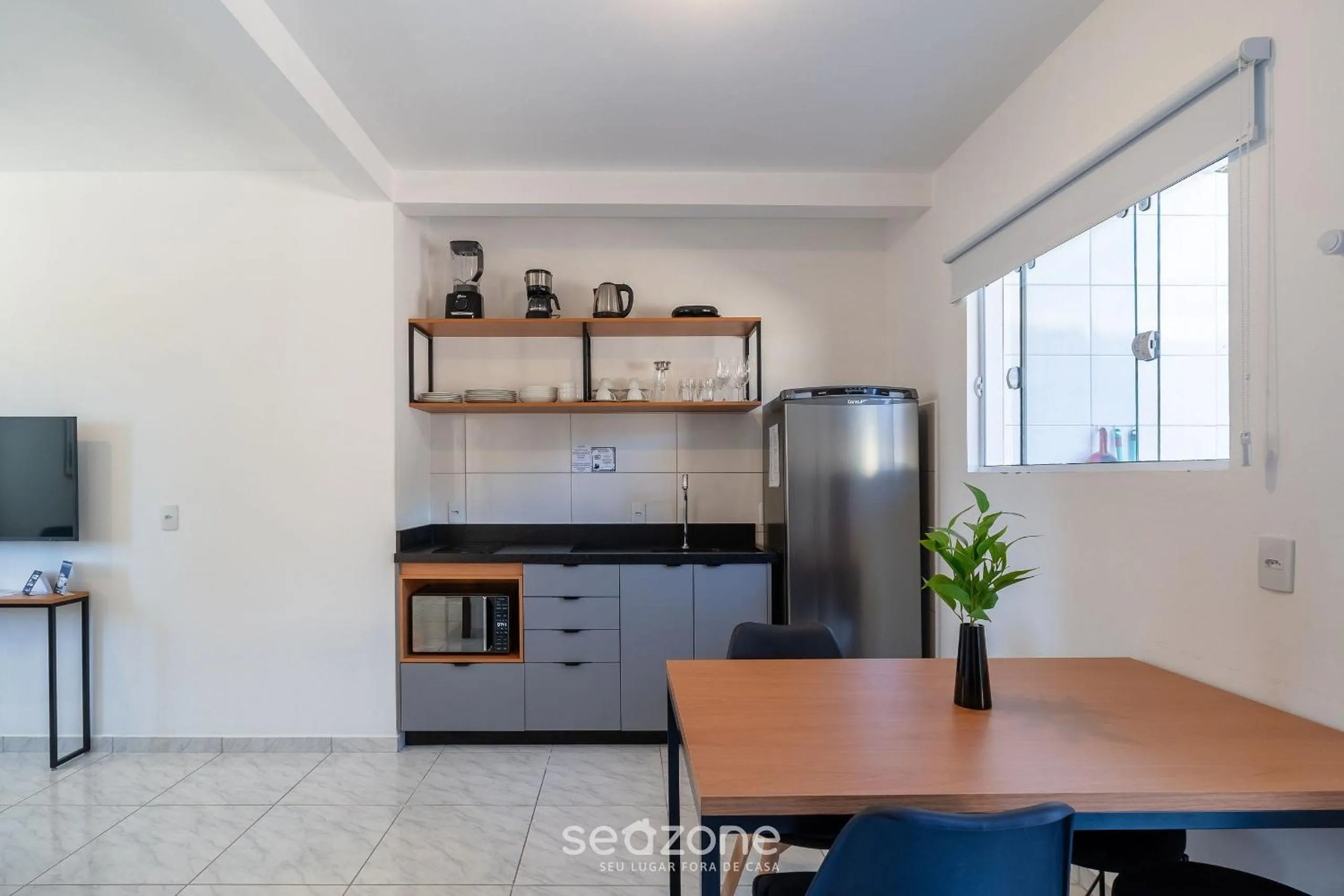 Kitchen or kitchenette in Apartamentos em Jurerê - JMA