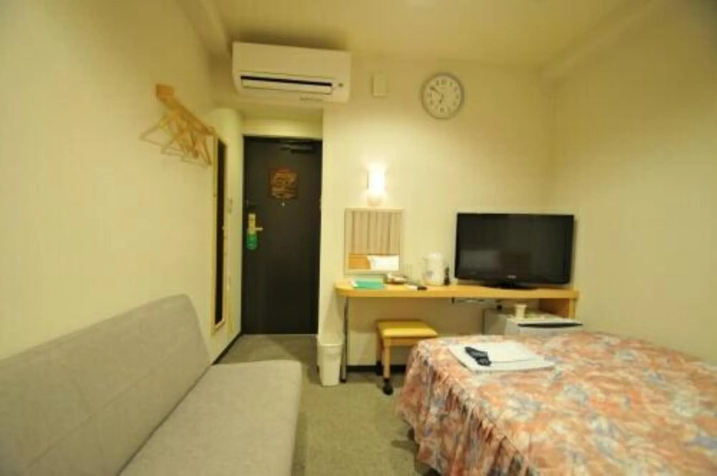 Photo of the whole room, Bed in Hiroshima Ekimae Universal Hotel