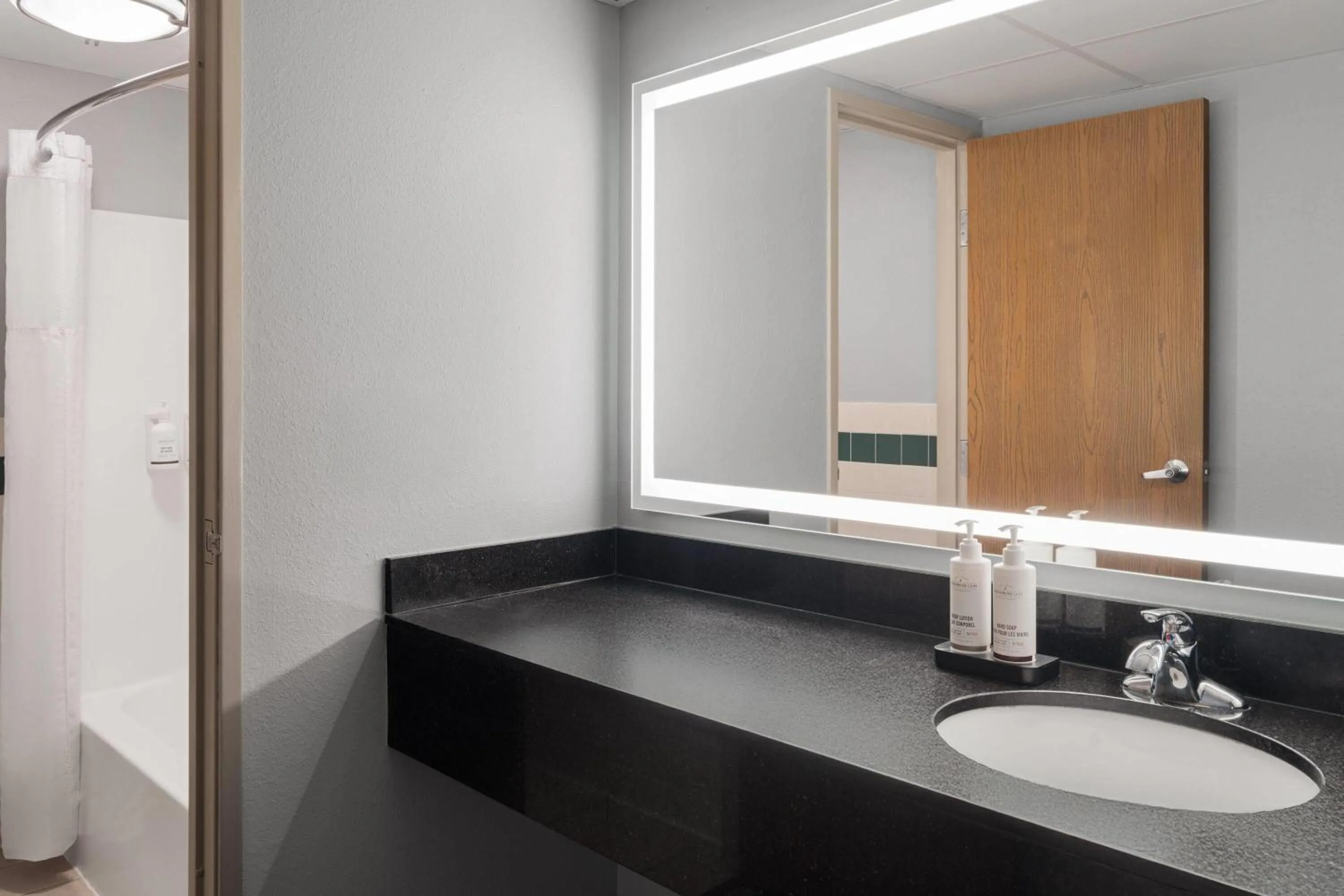 Bathroom in AmericInn by Wyndham Grand Forks