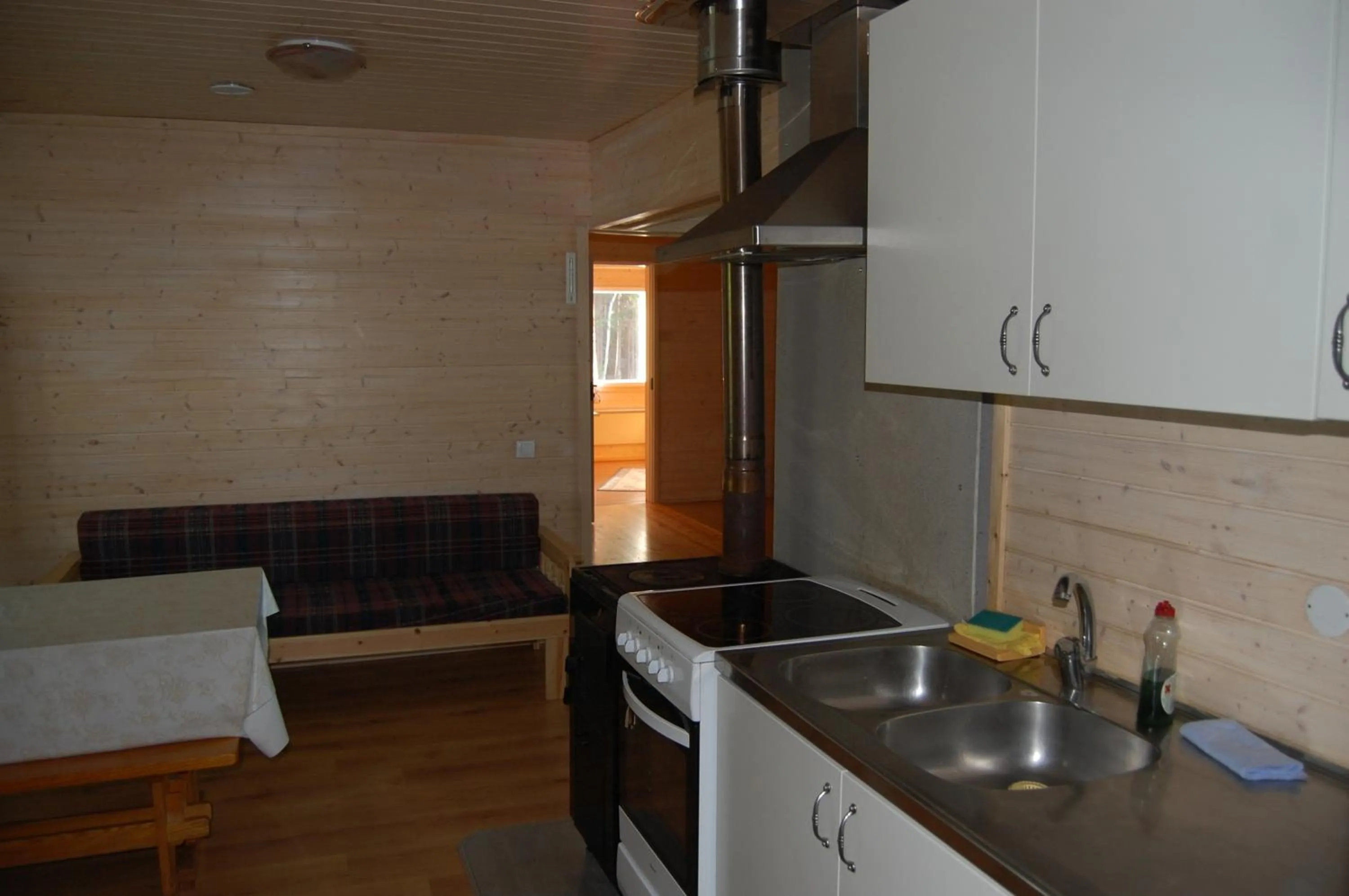 Kitchen or kitchenette in Lomasaaret Cottages