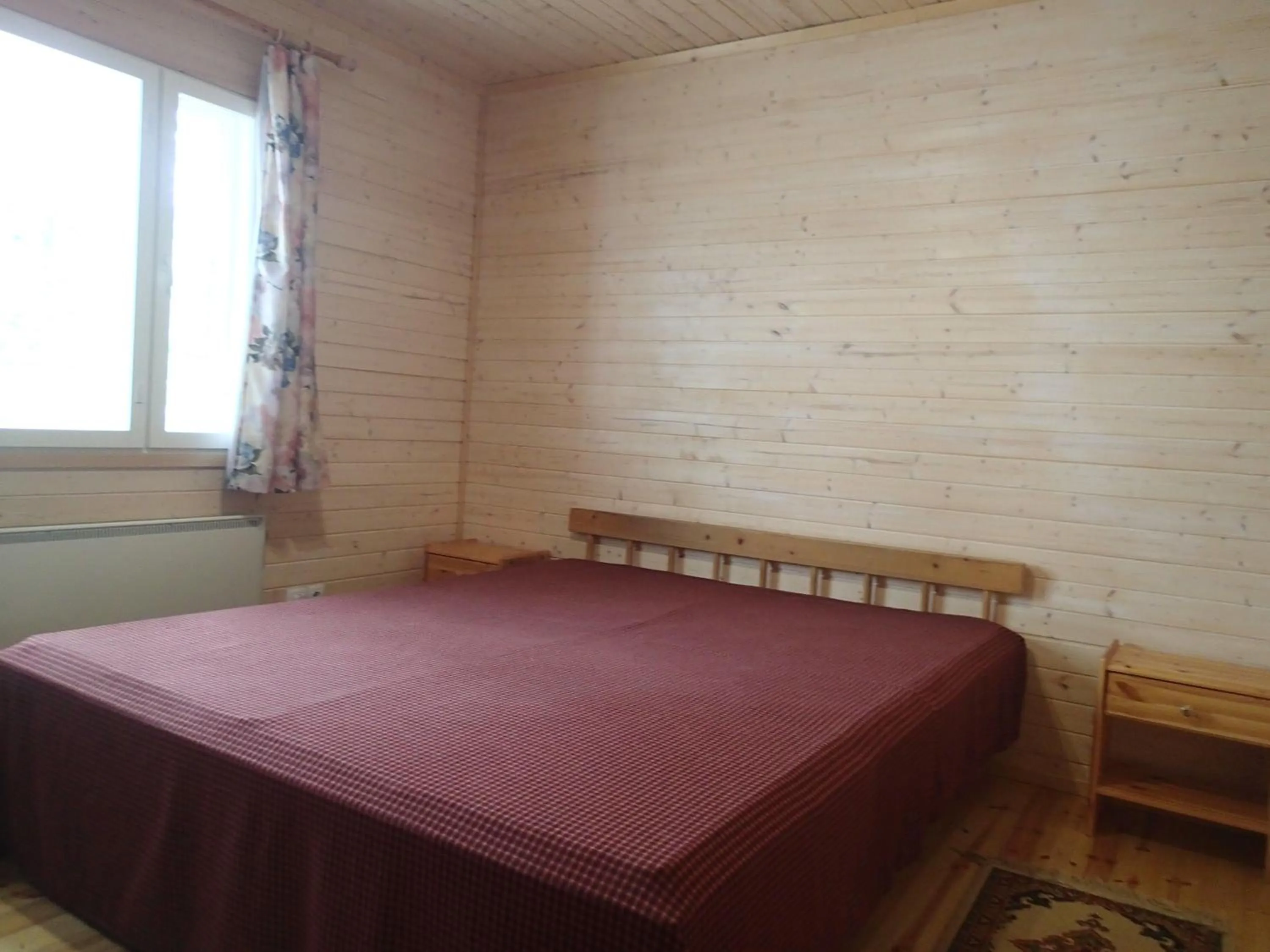 Bed in Lomasaaret Cottages