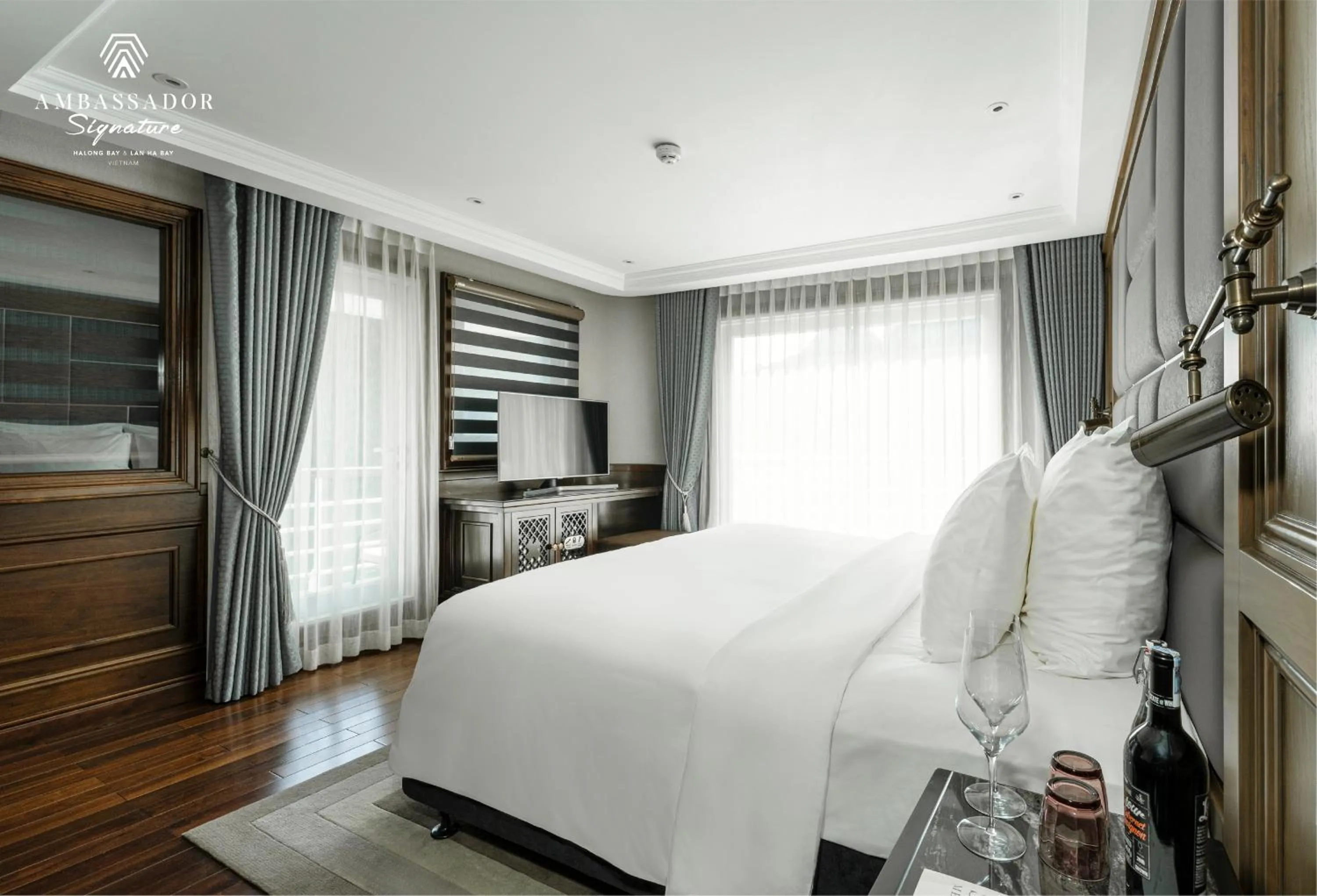 Photo of the whole room, Bed in Ambassador Signature Cruise - Lan Ha Bay