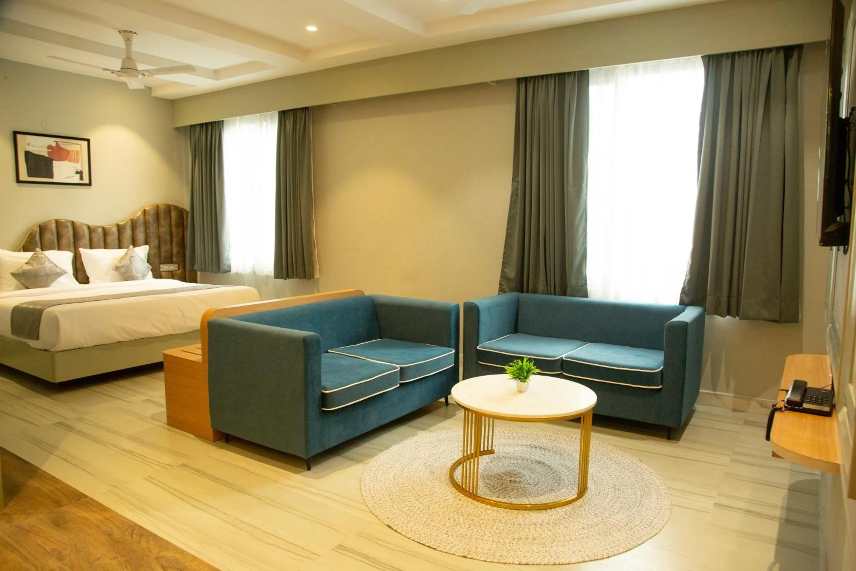 Seating area, Bed in Cosmos Westend City Centre