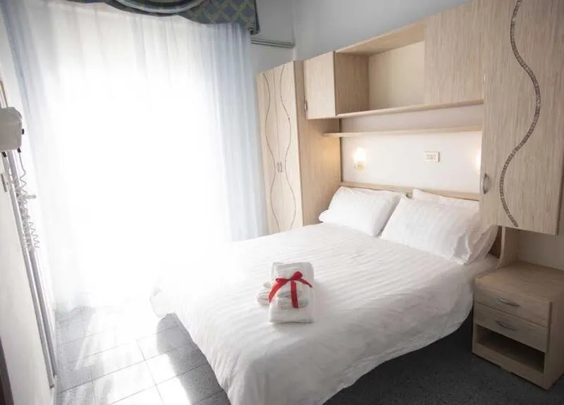 Bed in Hotel Gardenia