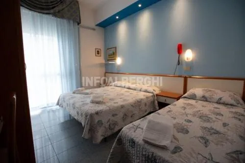 Bed in Hotel Gardenia