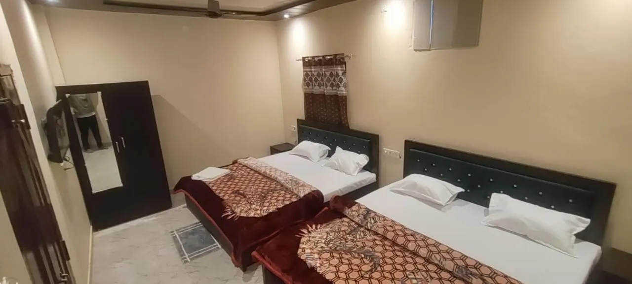 Bed in Raghuvanshi Paying Guest House