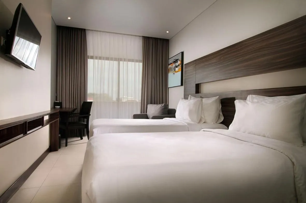 Bed in HELIOS HOTEL & CONVENTION