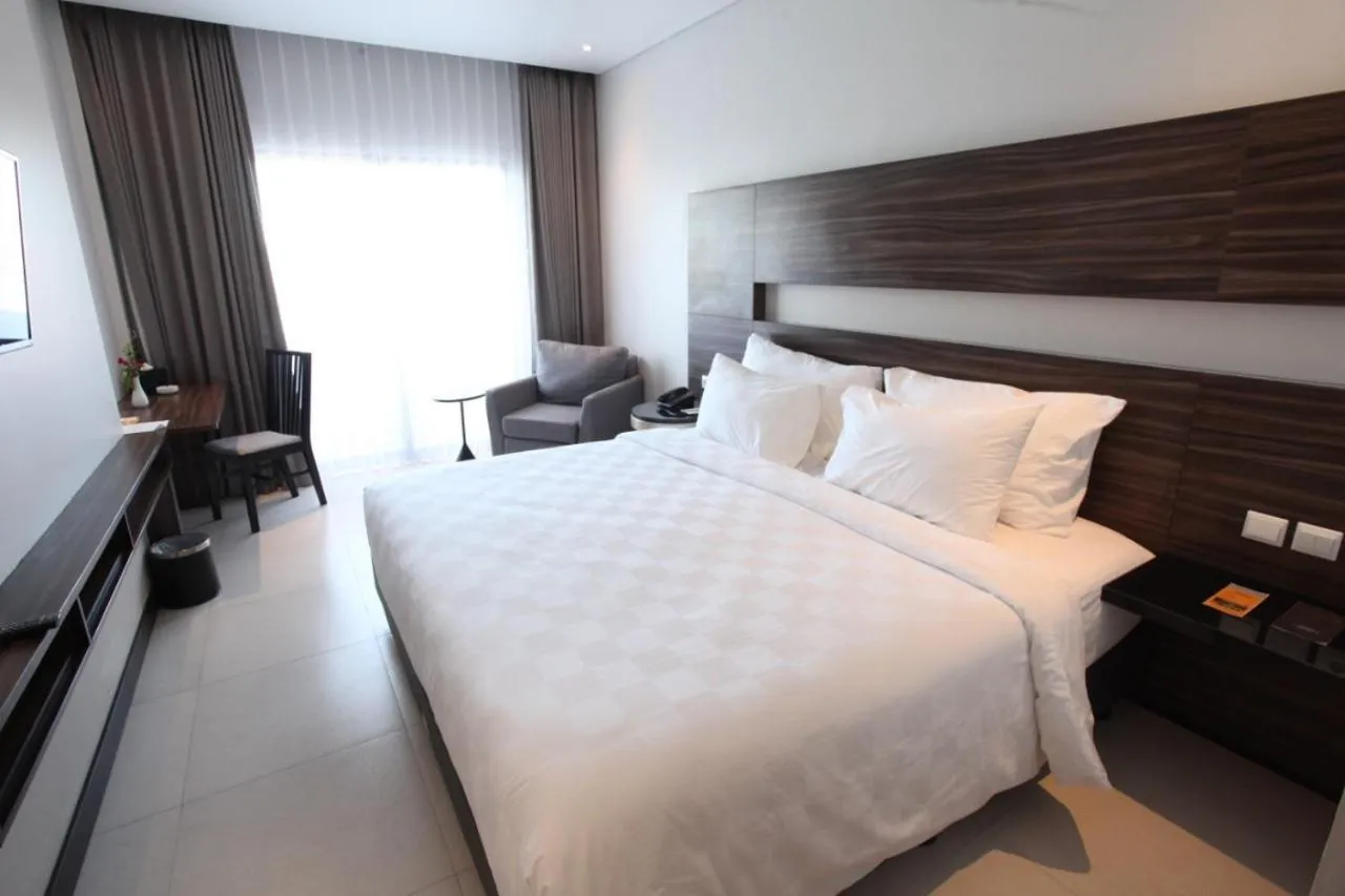 Bed in HELIOS HOTEL & CONVENTION