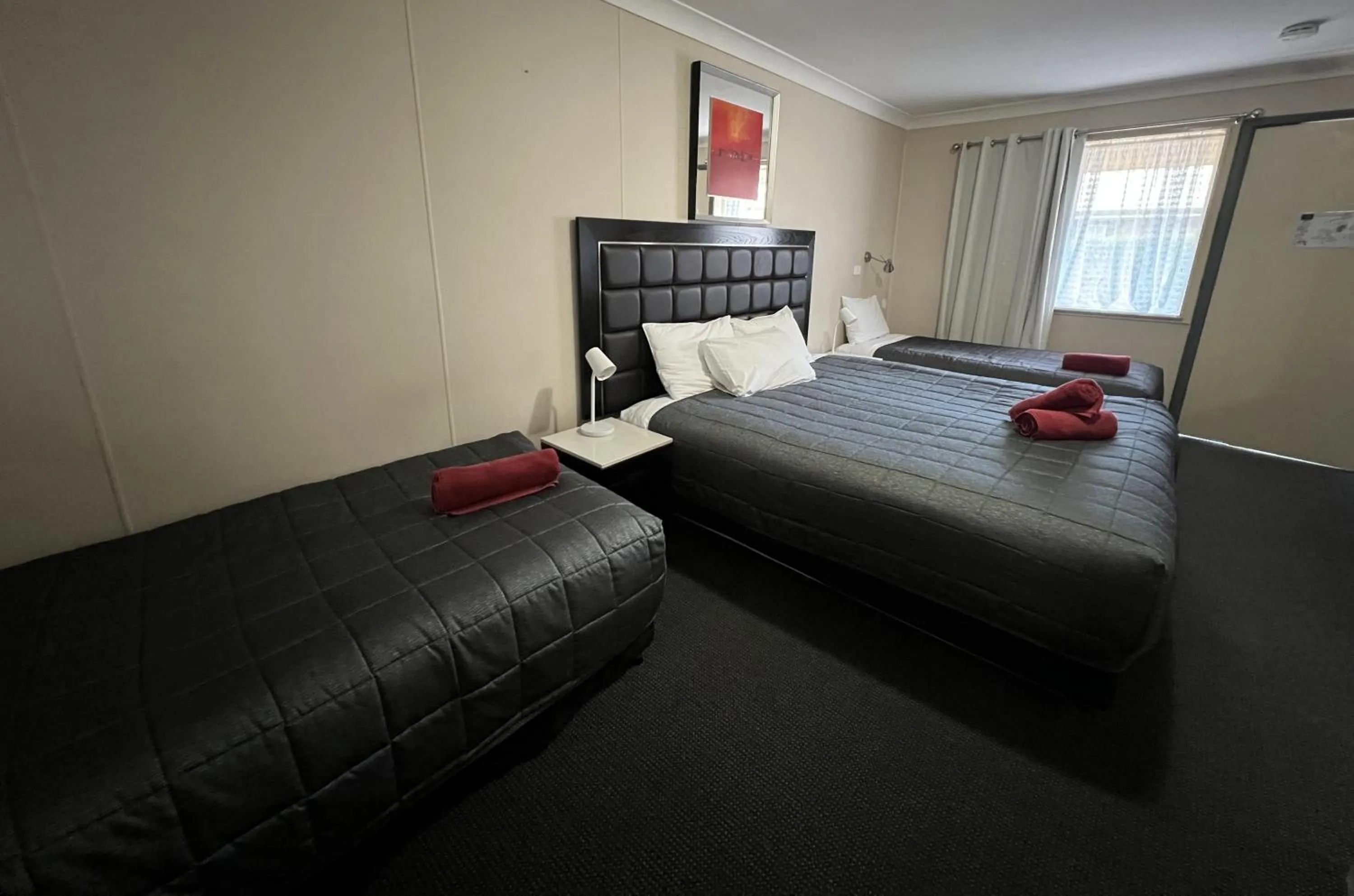 Bed in Almond Inn Motel