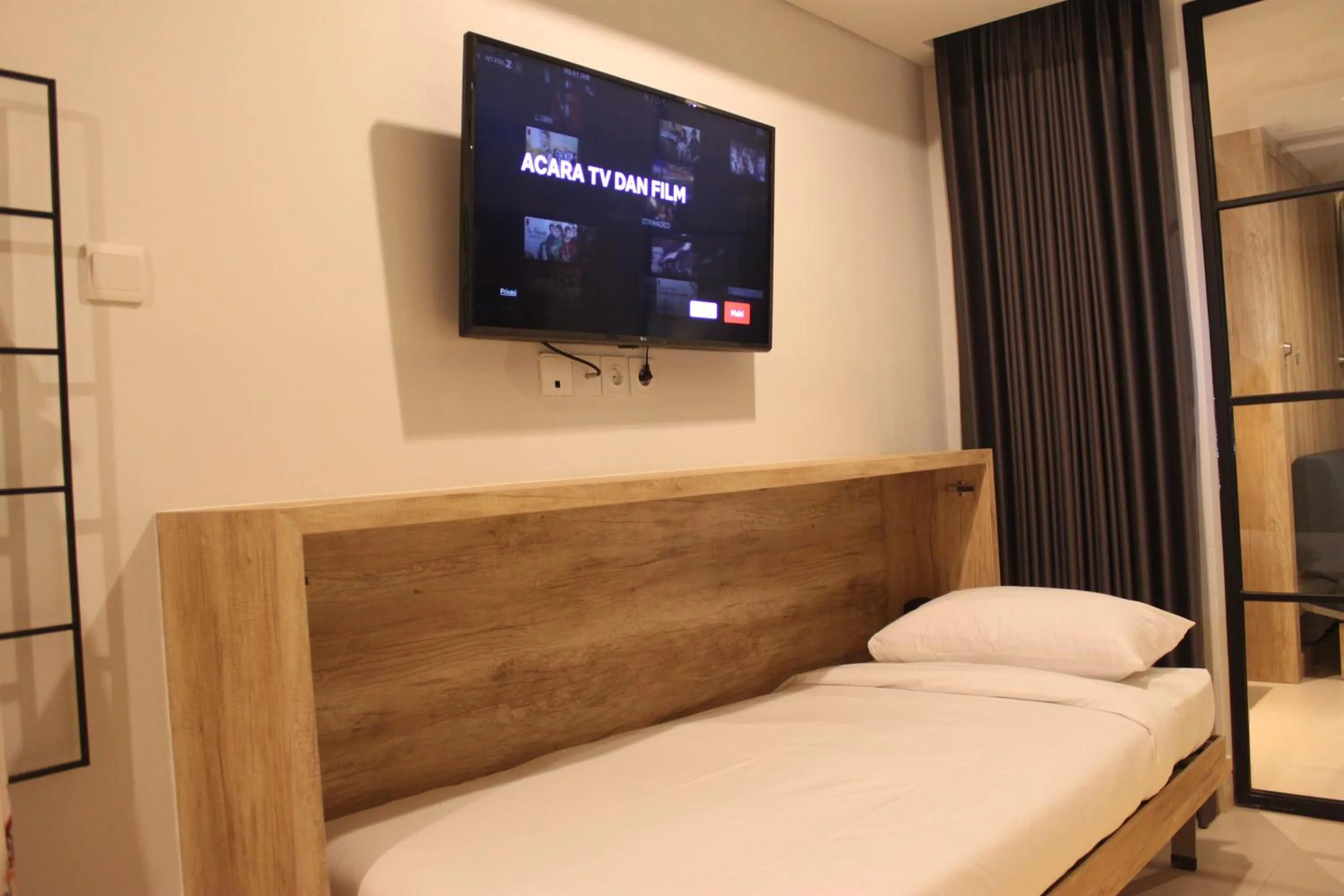 Communal lounge/ TV room, Bed in Anagata Hotels and Resorts Tanjung Benoa
