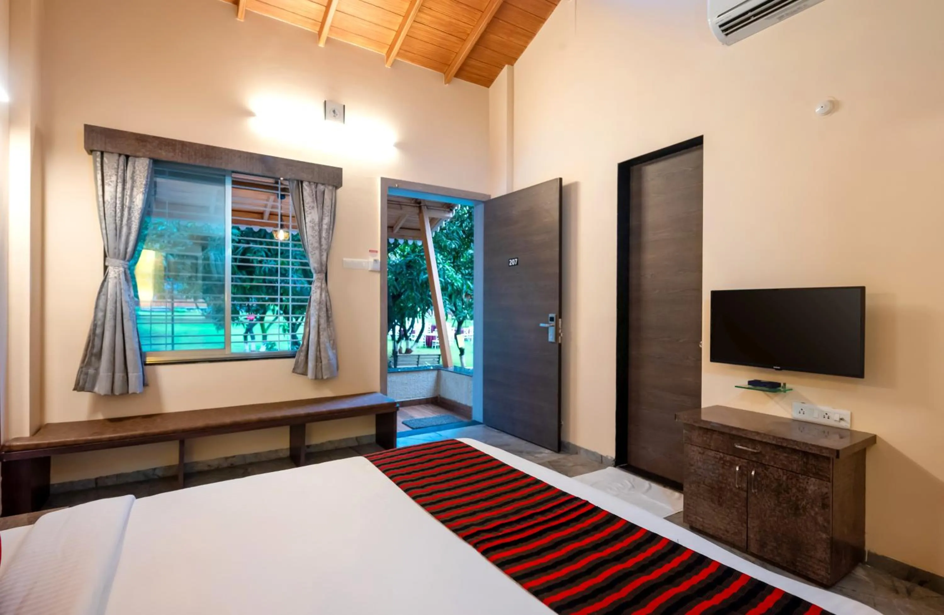 Bed in Freesia Resort by Express Inn