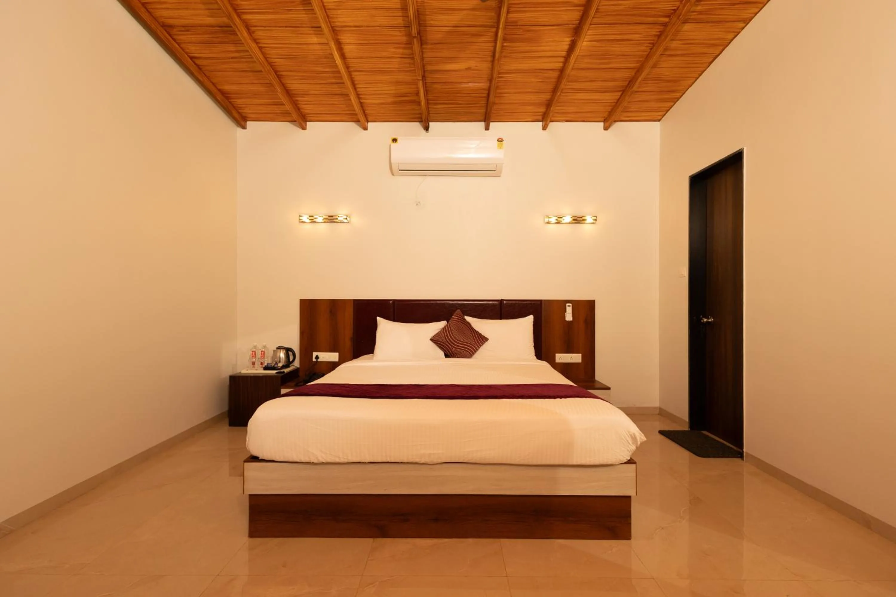 Bed in Freesia Resort by Express Inn