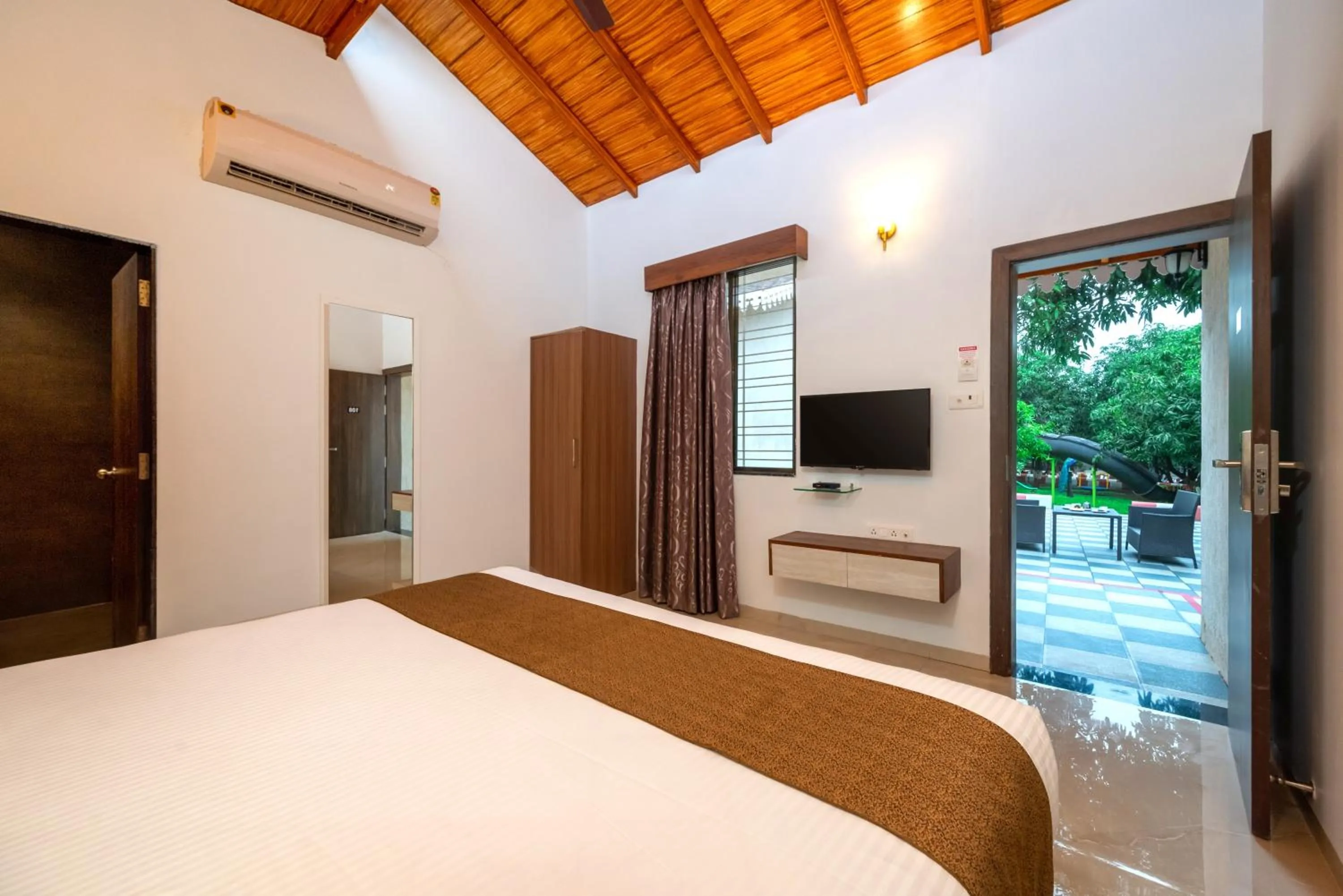 Bed in Freesia Resort by Express Inn