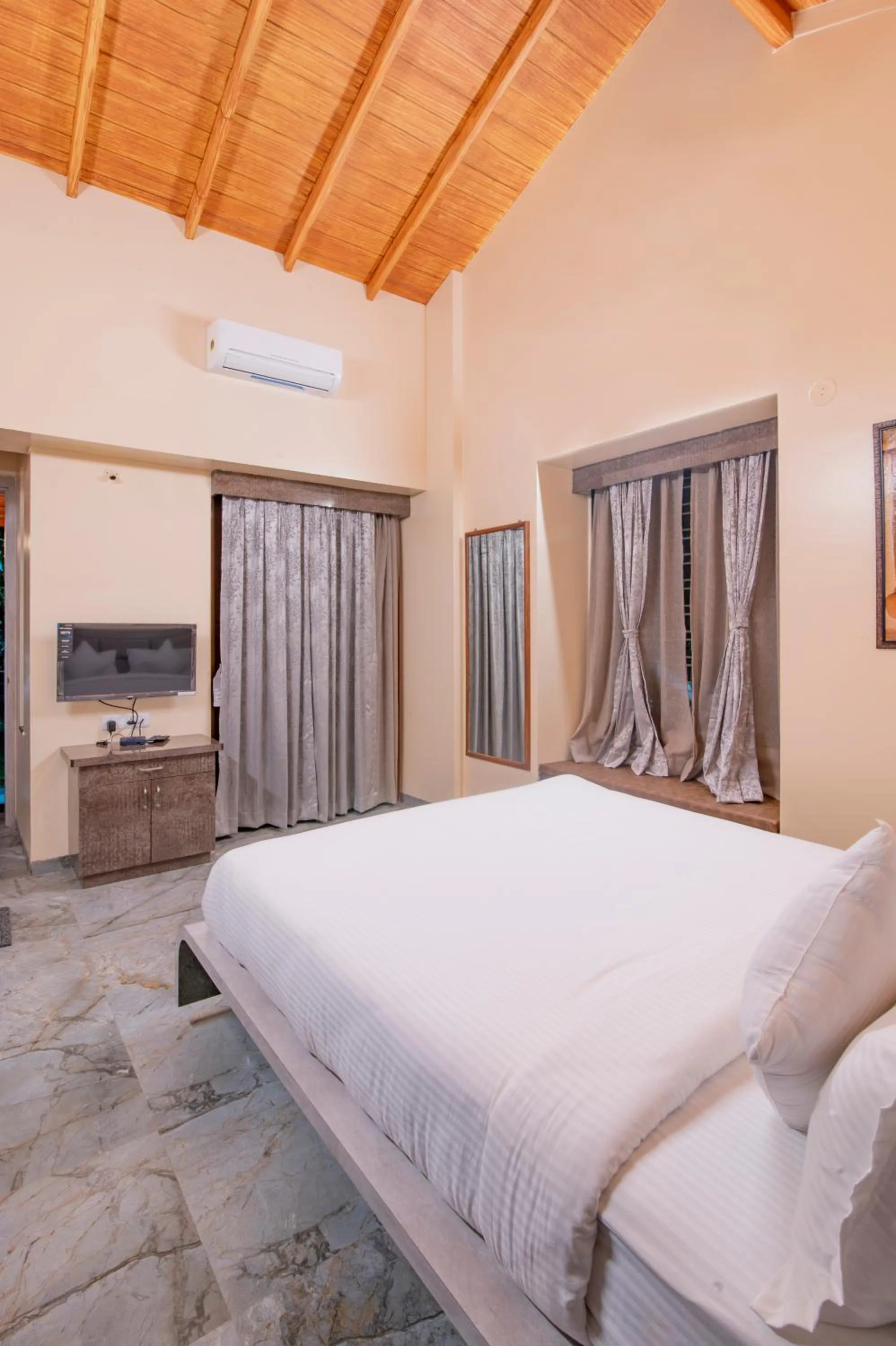 Bed in Freesia Resort by Express Inn