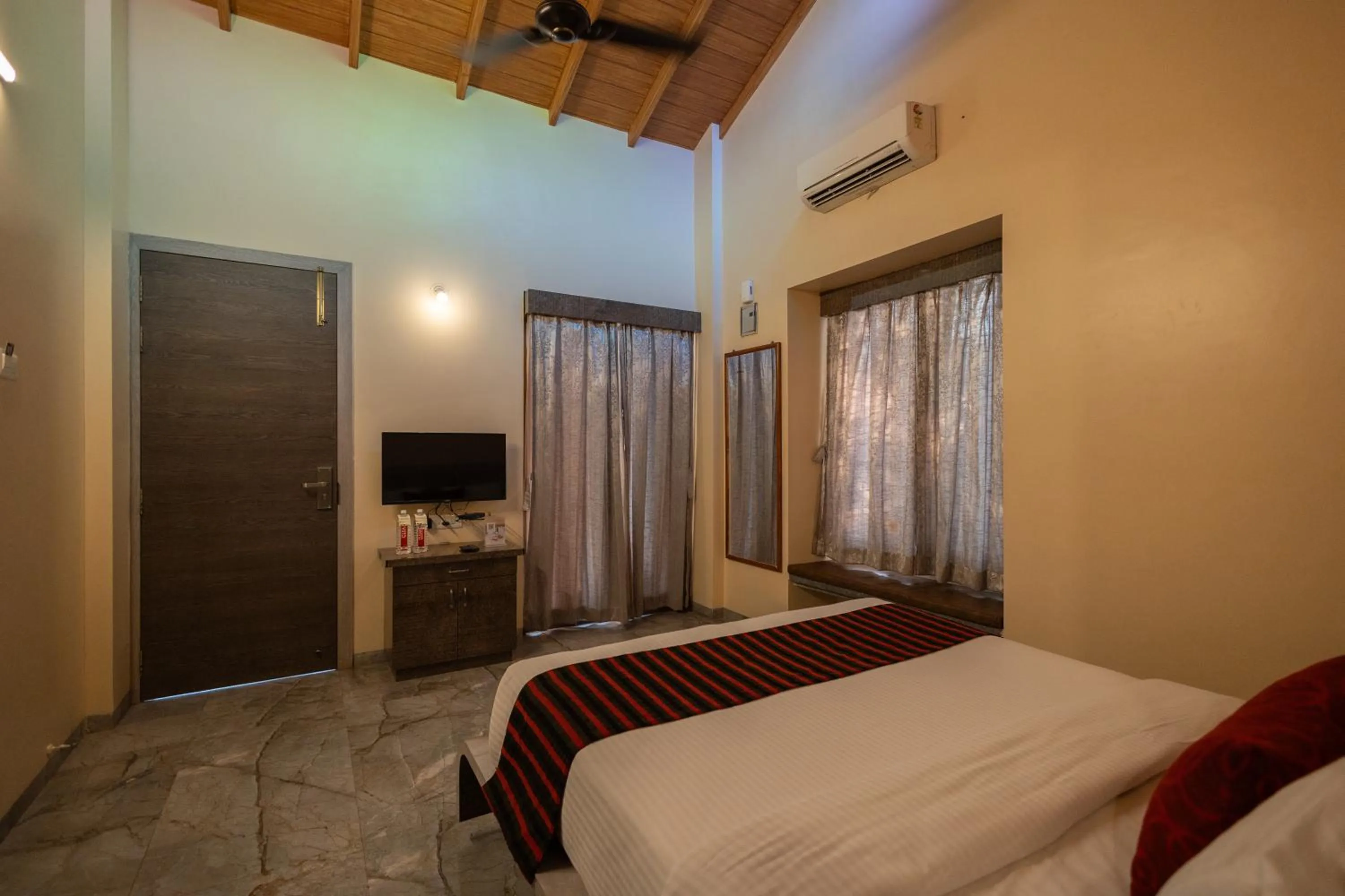 Bed in Freesia Resort by Express Inn