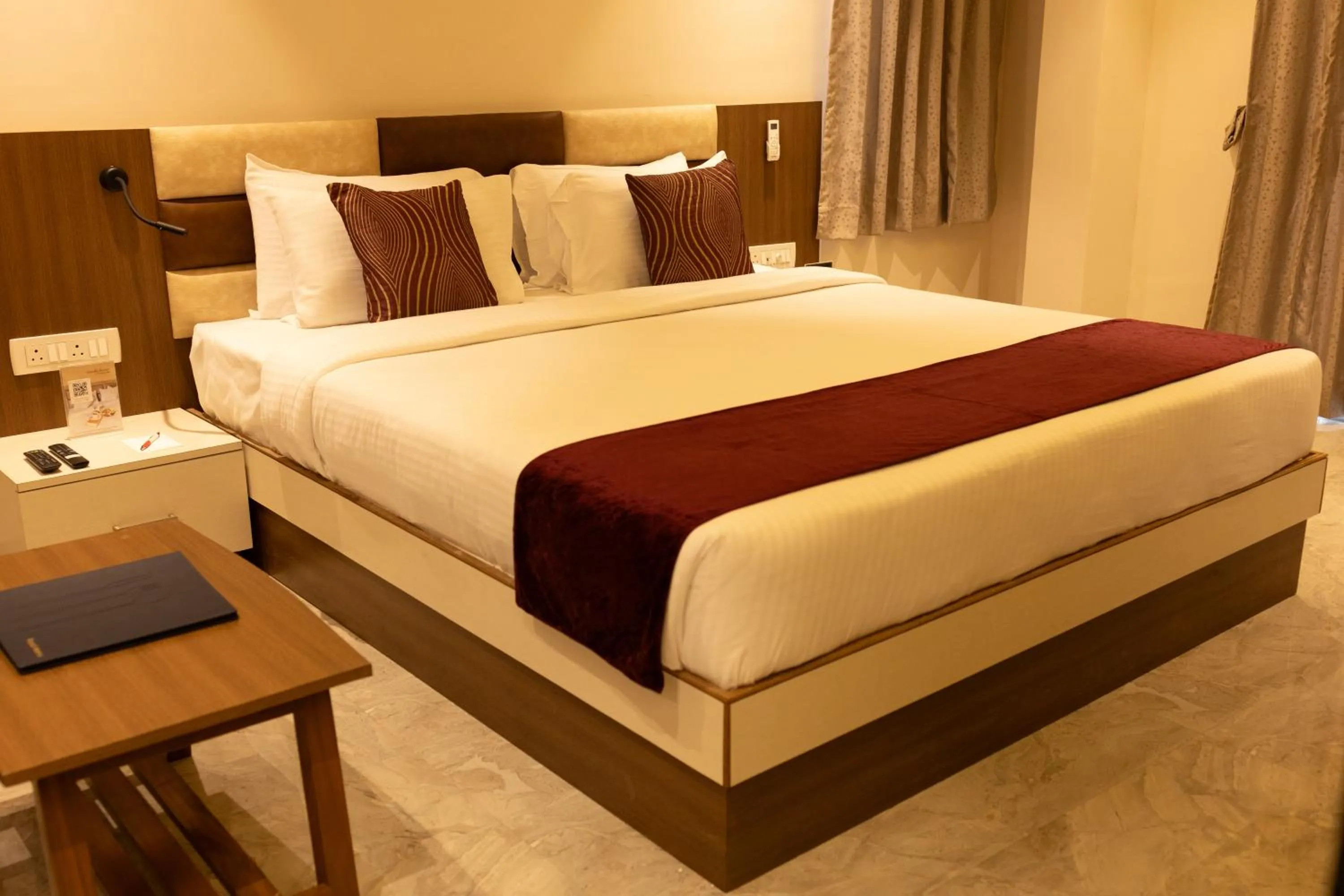 Bed in Freesia Resort by Express Inn