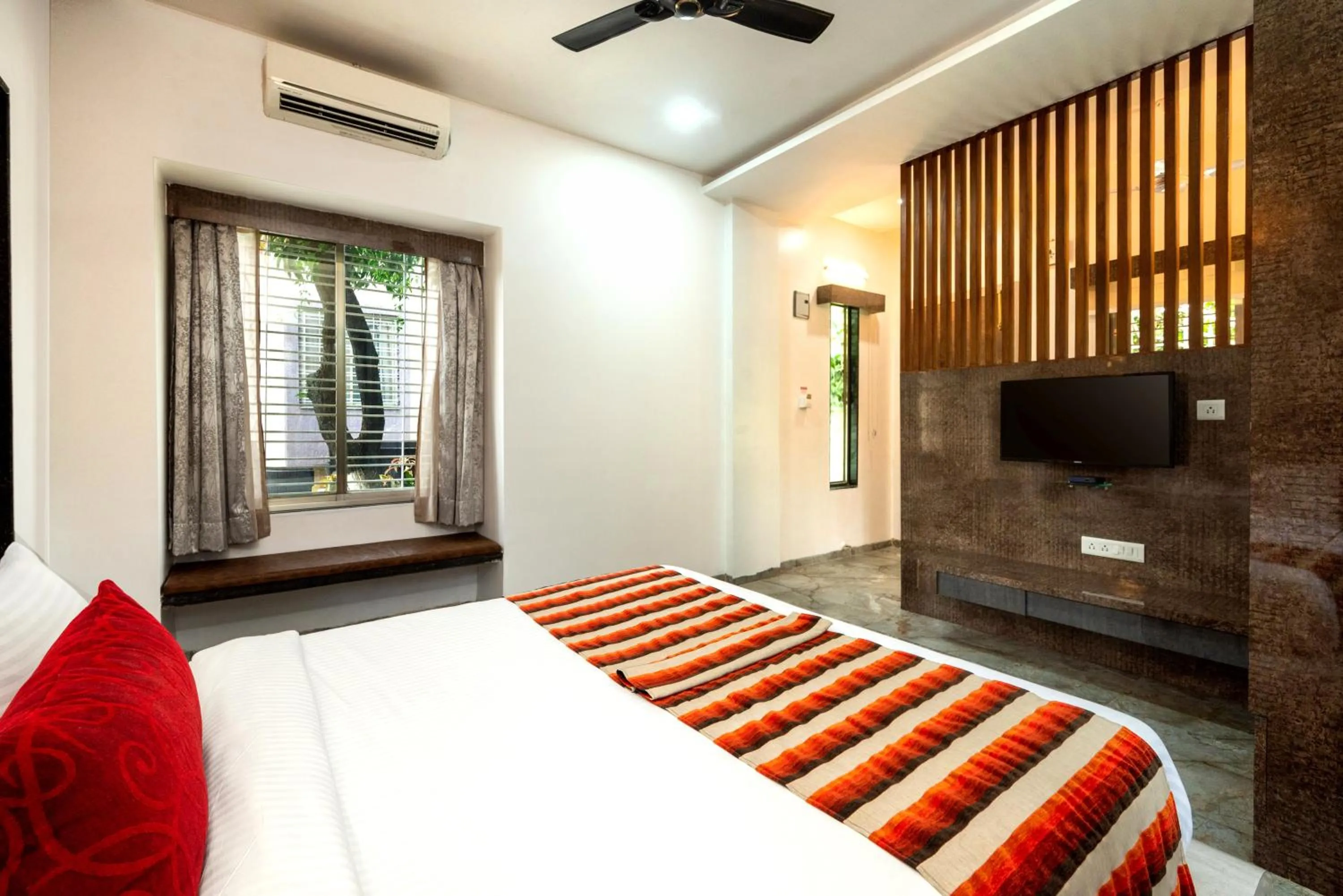 Bed in Freesia Resort by Express Inn