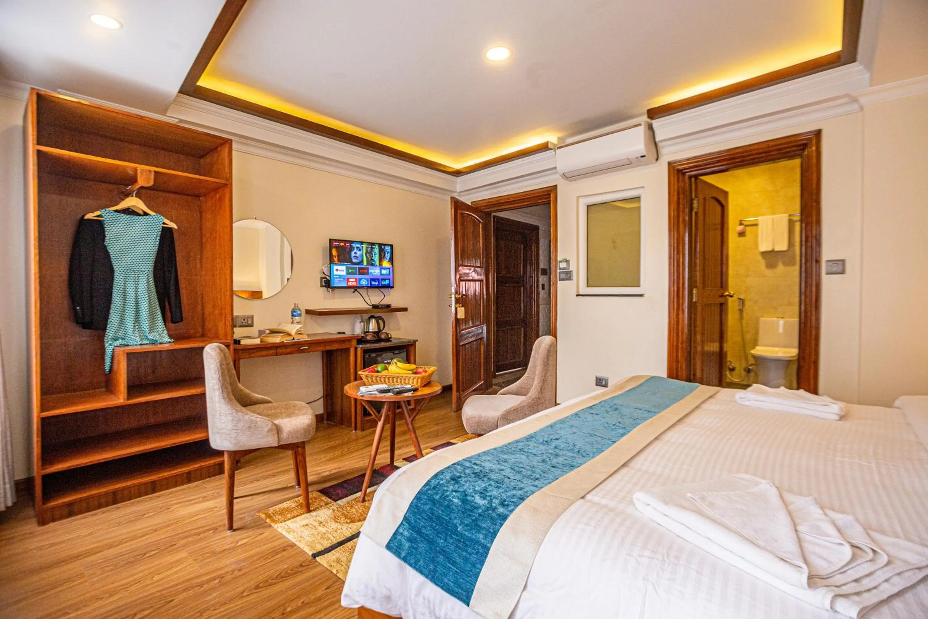 Communal lounge/ TV room, Bed in Darbar Heritage Inn