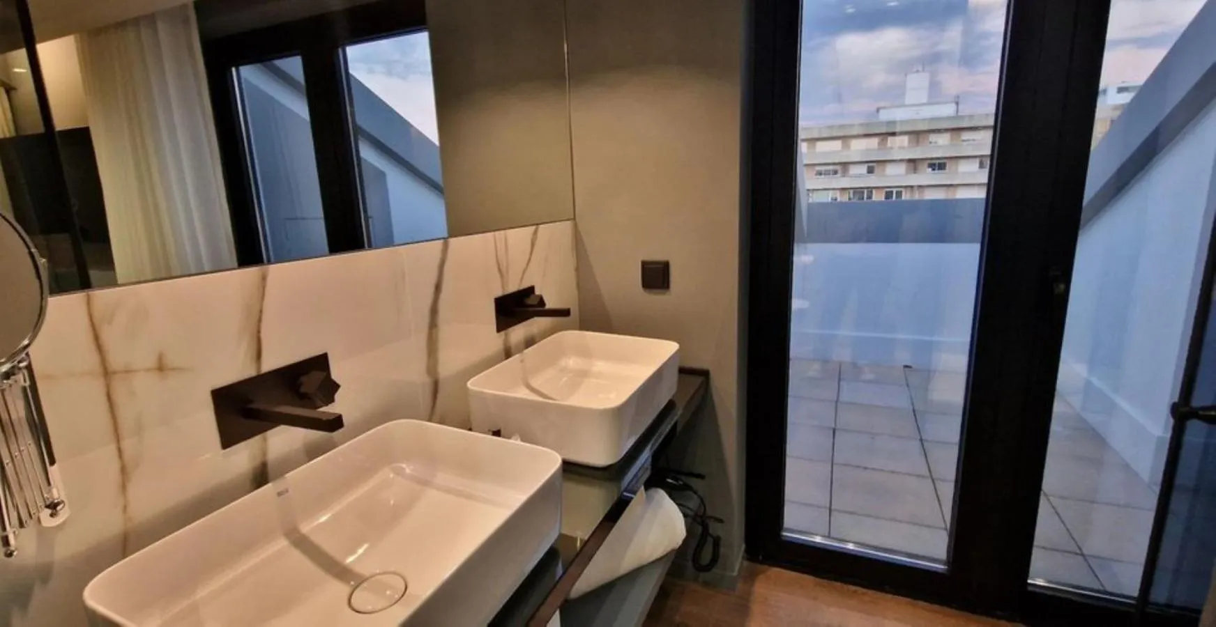 Bathroom in Bom Sucesso Hotel by gaiarooms