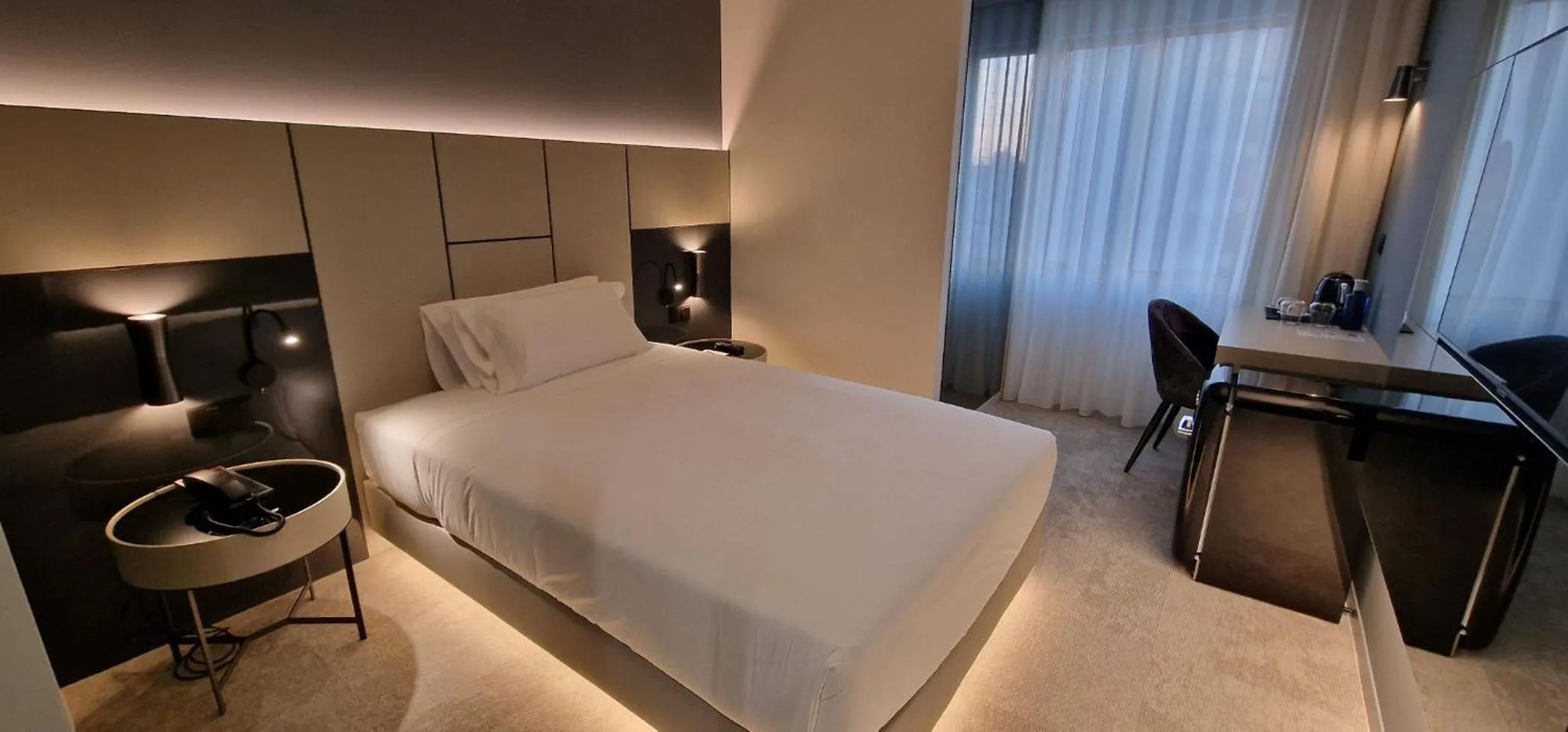 Bed in Bom Sucesso Hotel by gaiarooms