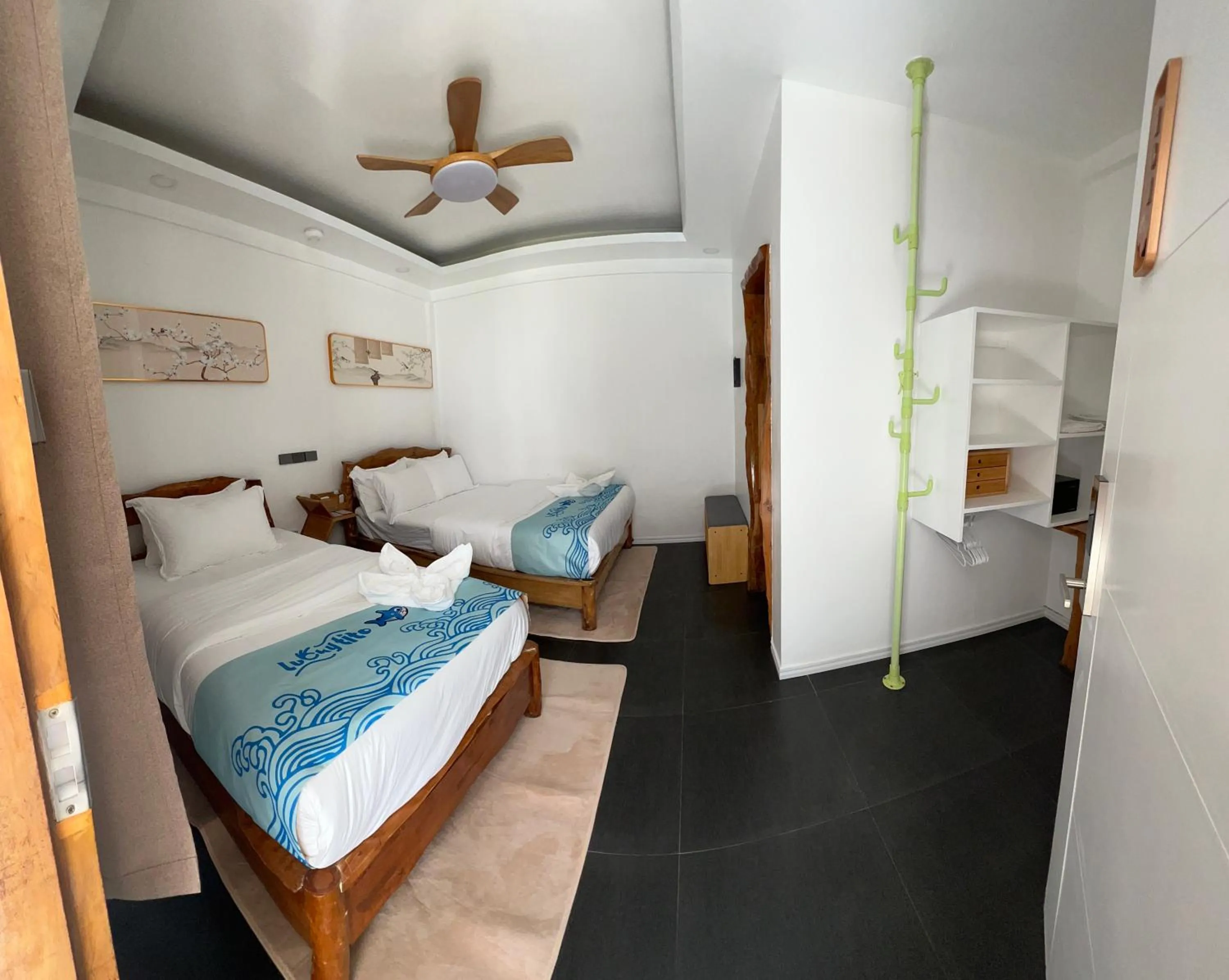 Bed in Lucky Tito PG Dive Resort