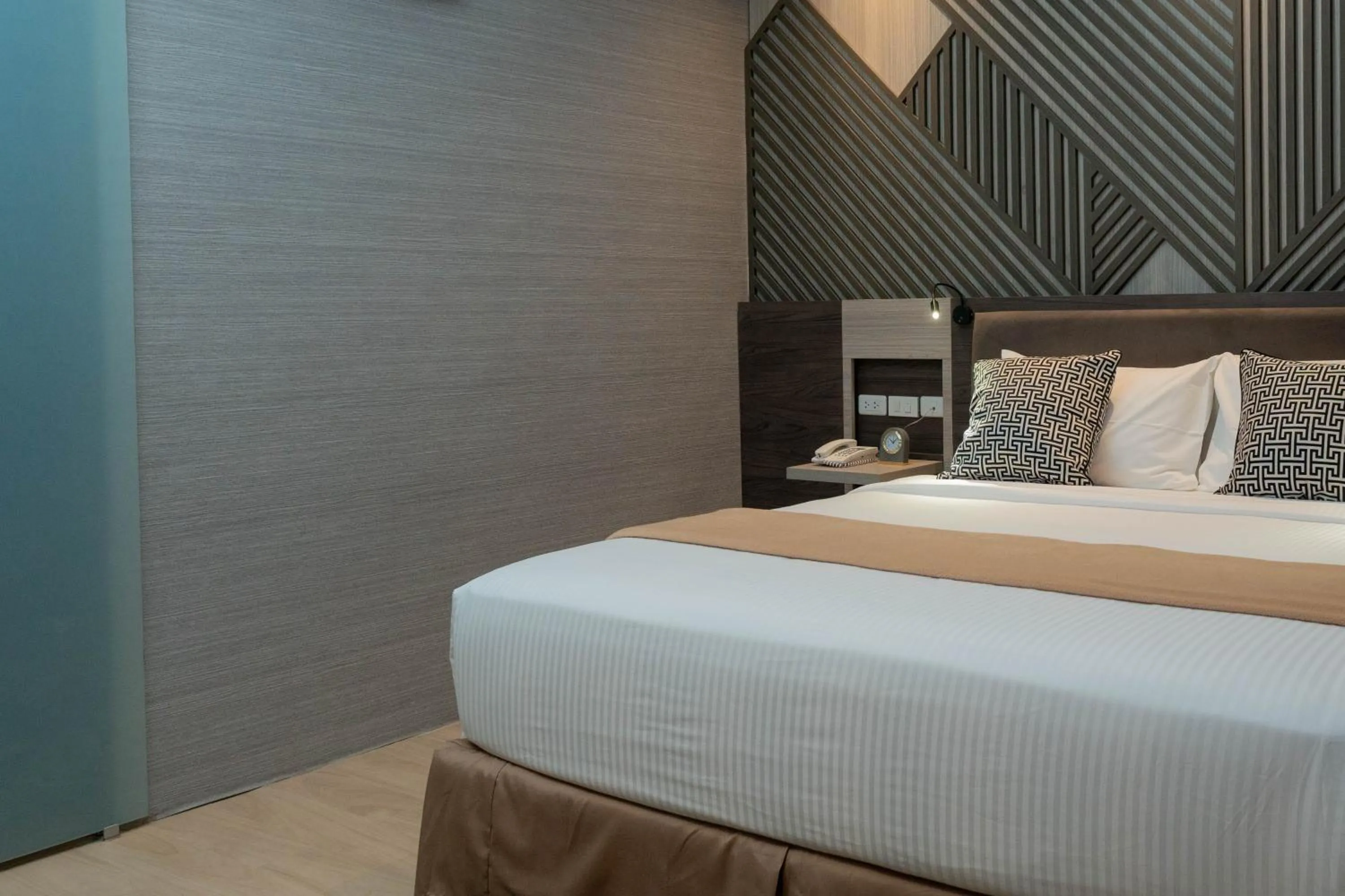 Bed in Adelina Hotel and Suites