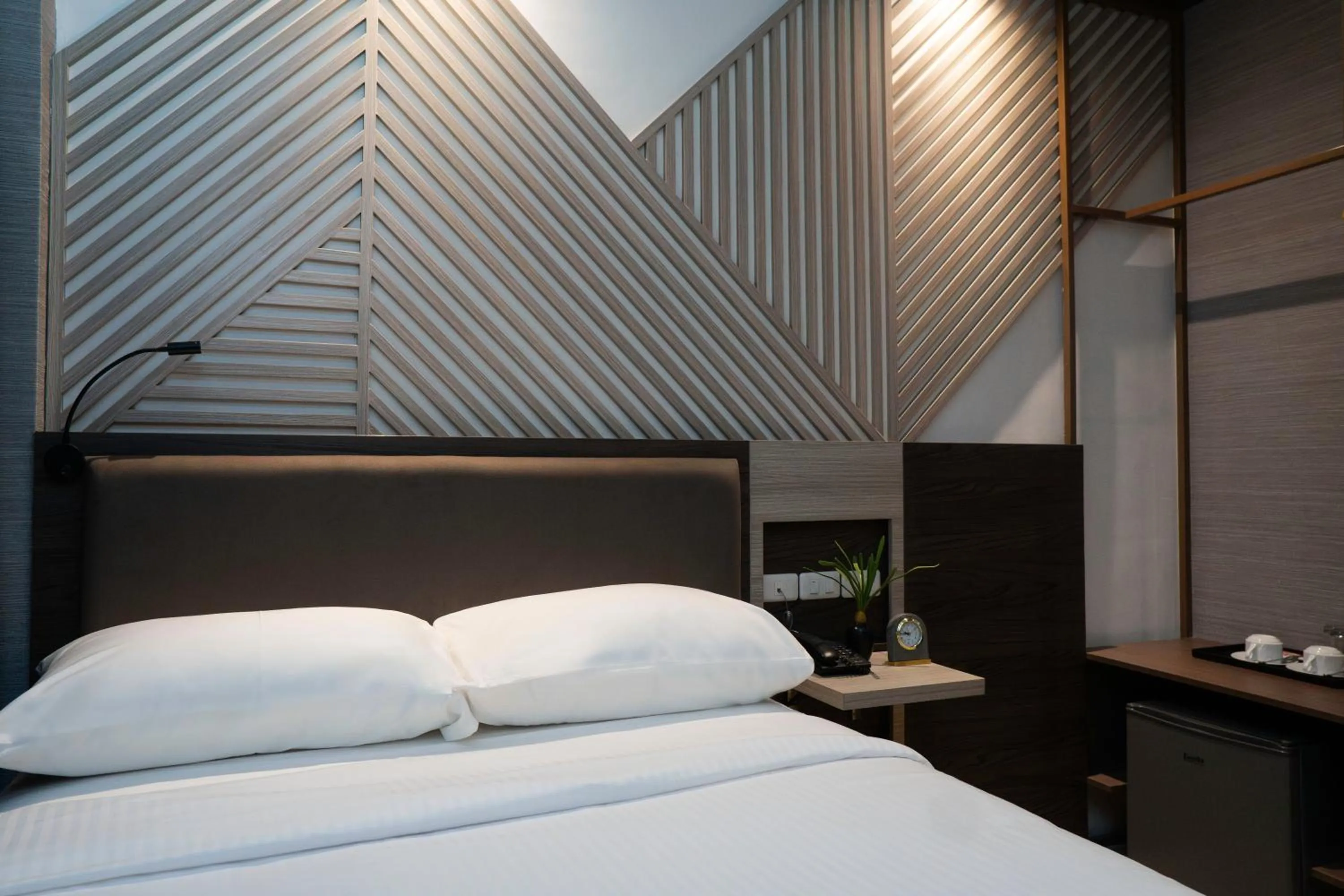 Bed in Adelina Hotel and Suites