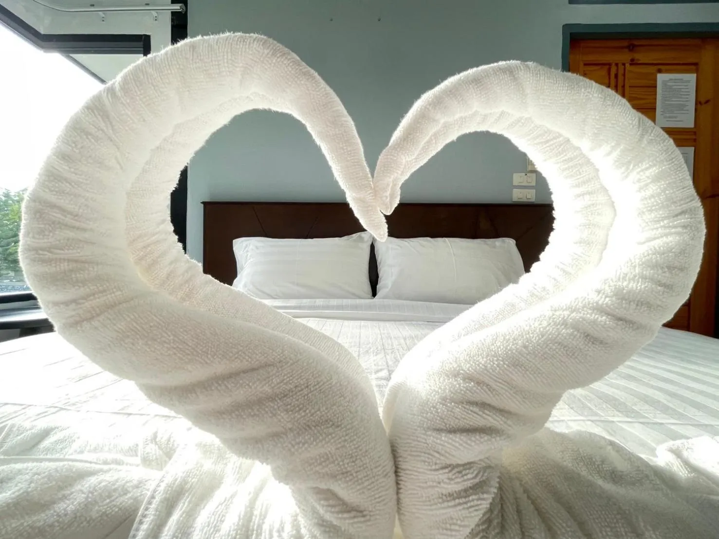 towels, Bed in Suptara Resort