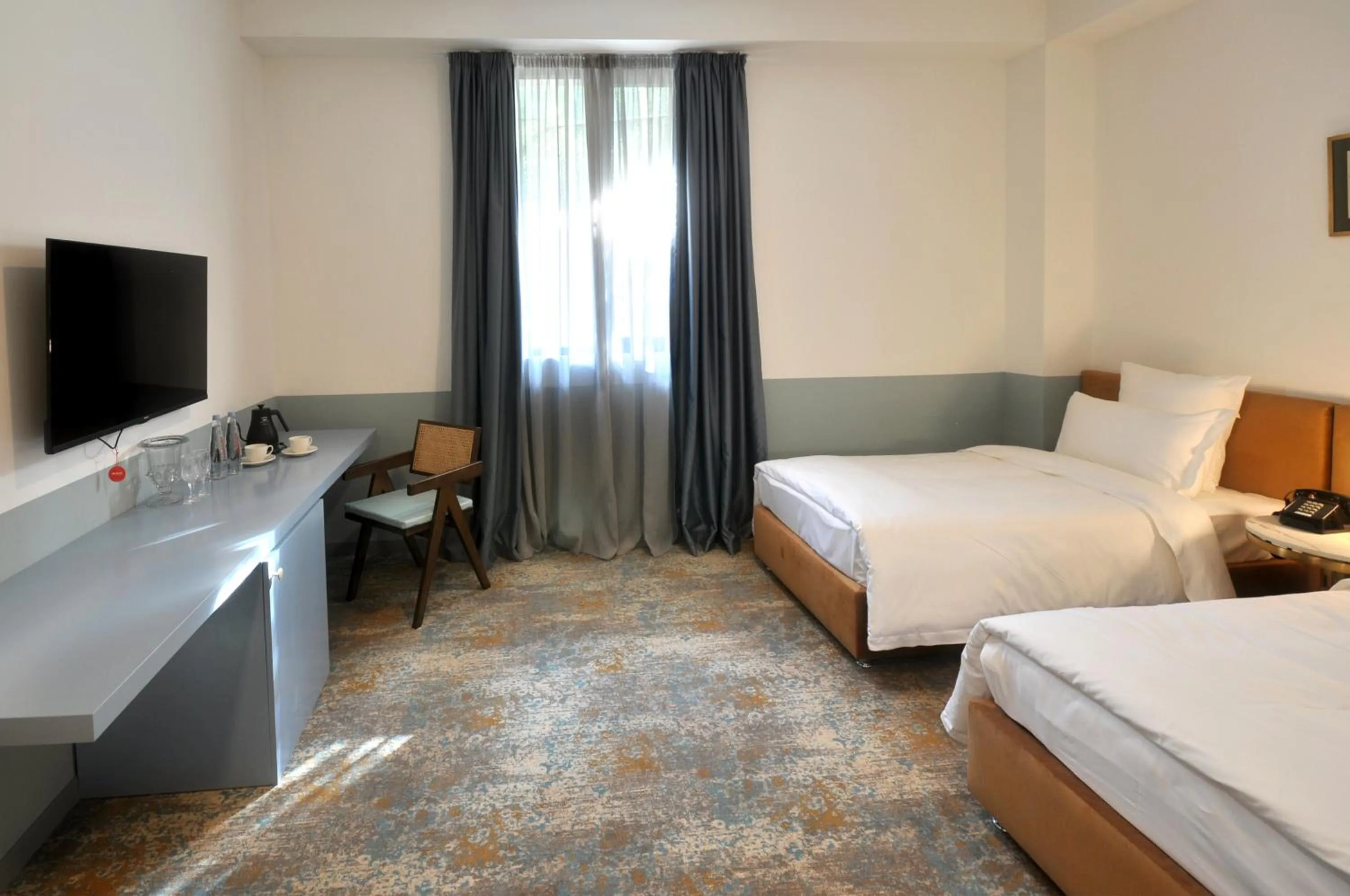 Bed in Castor & Pollux Hotel