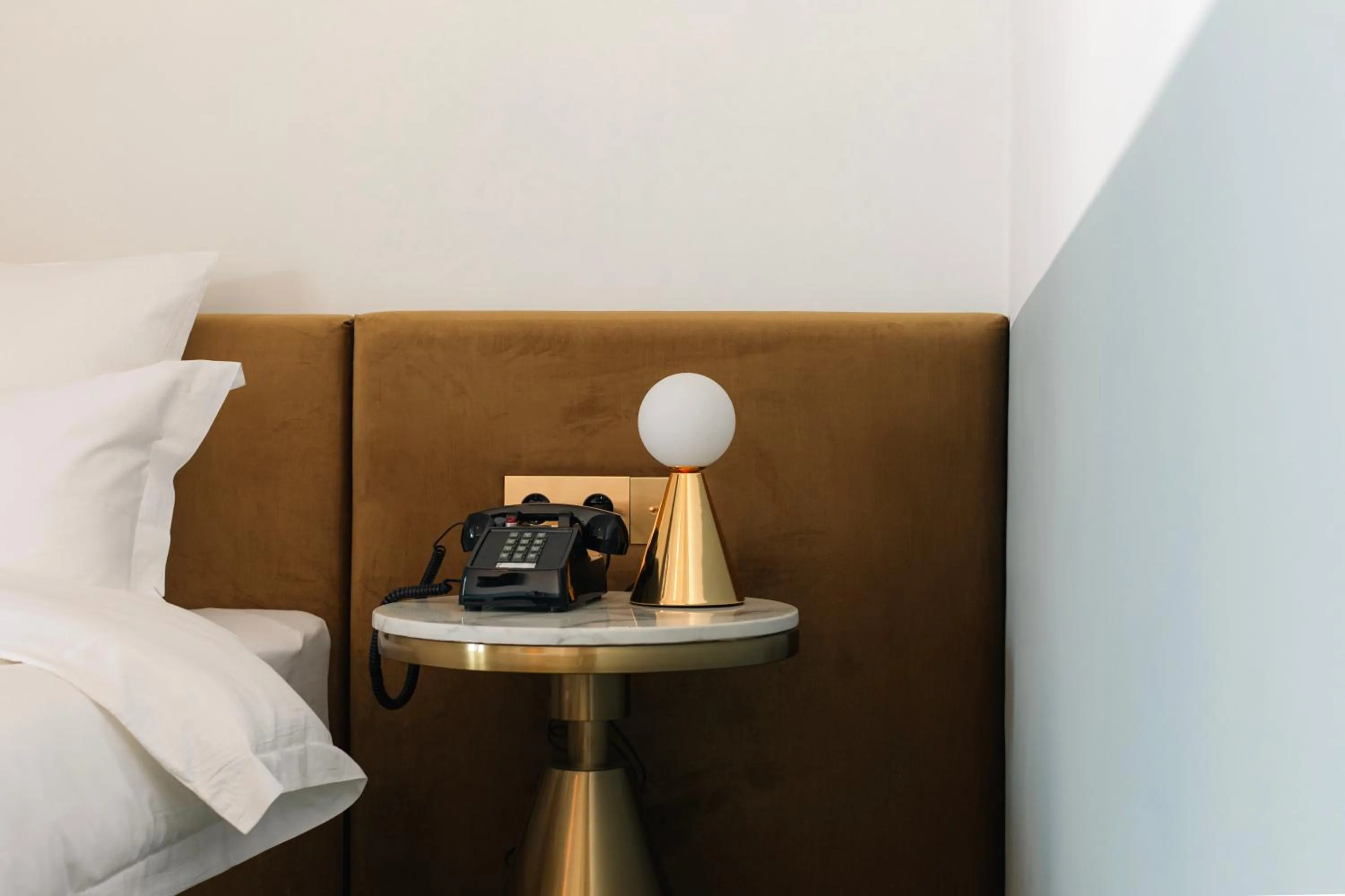 Bed in Castor & Pollux Hotel