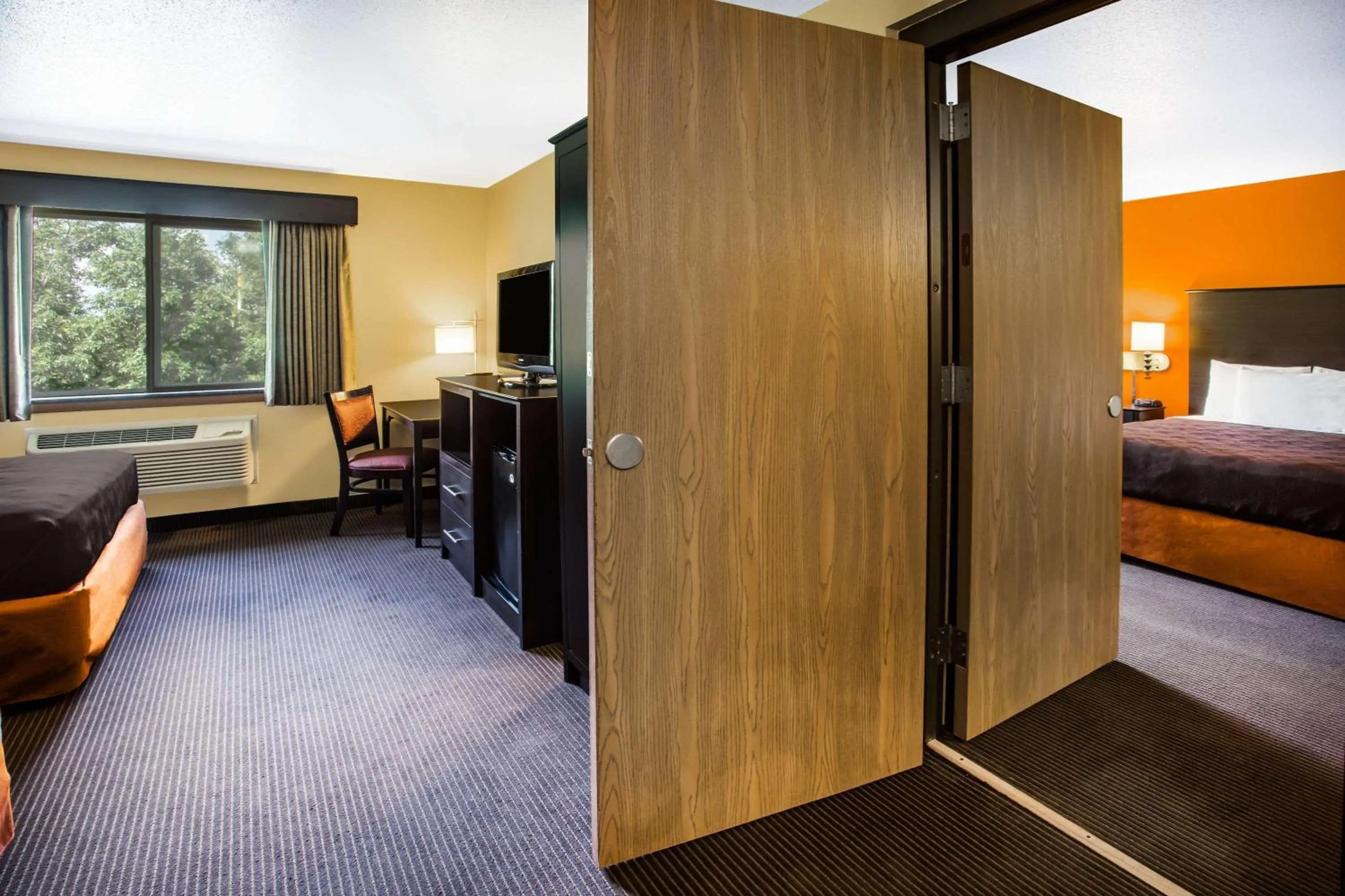 Photo of the whole room, Bed in AmericInn by Wyndham Menomonie