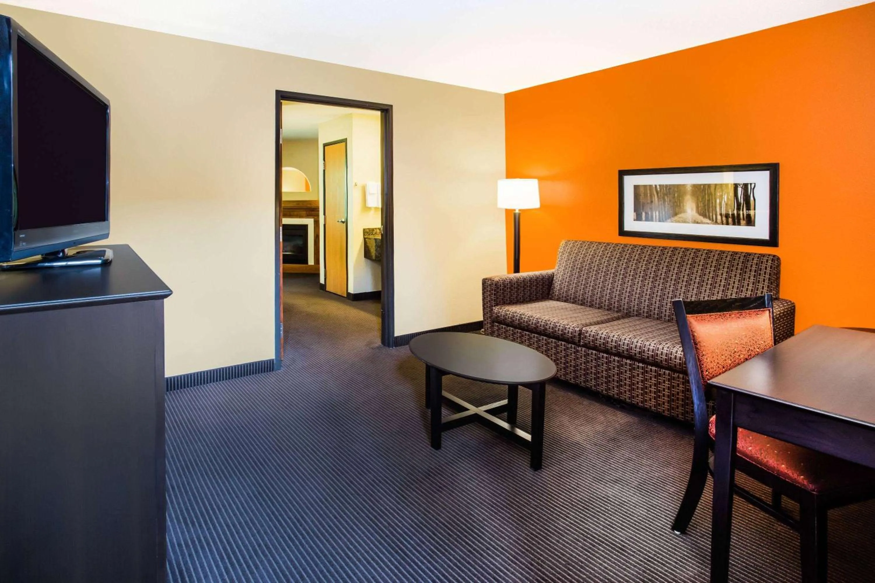 Living room in AmericInn by Wyndham Menomonie