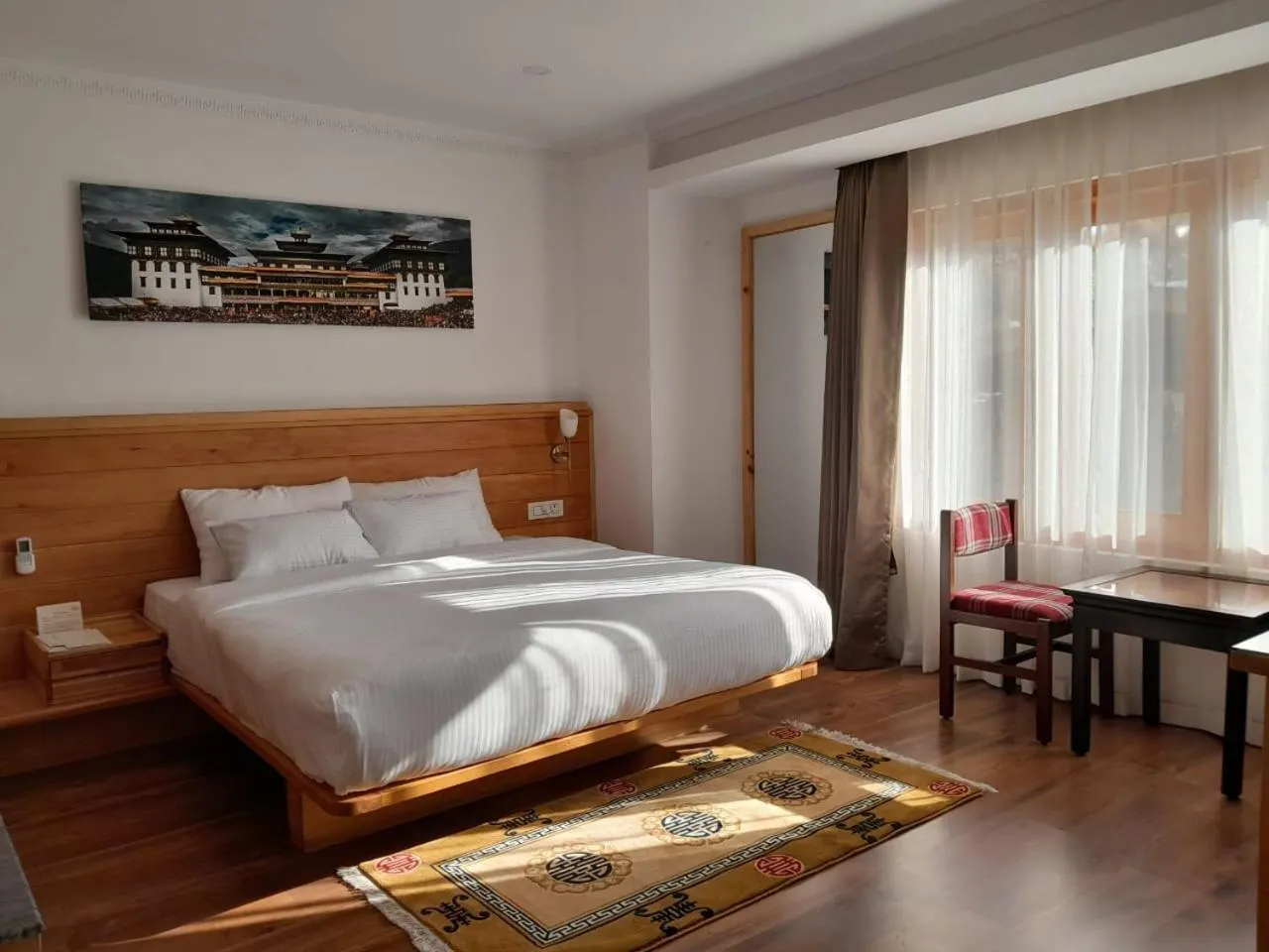 Bed in Phuntsho Khangsar Hotel