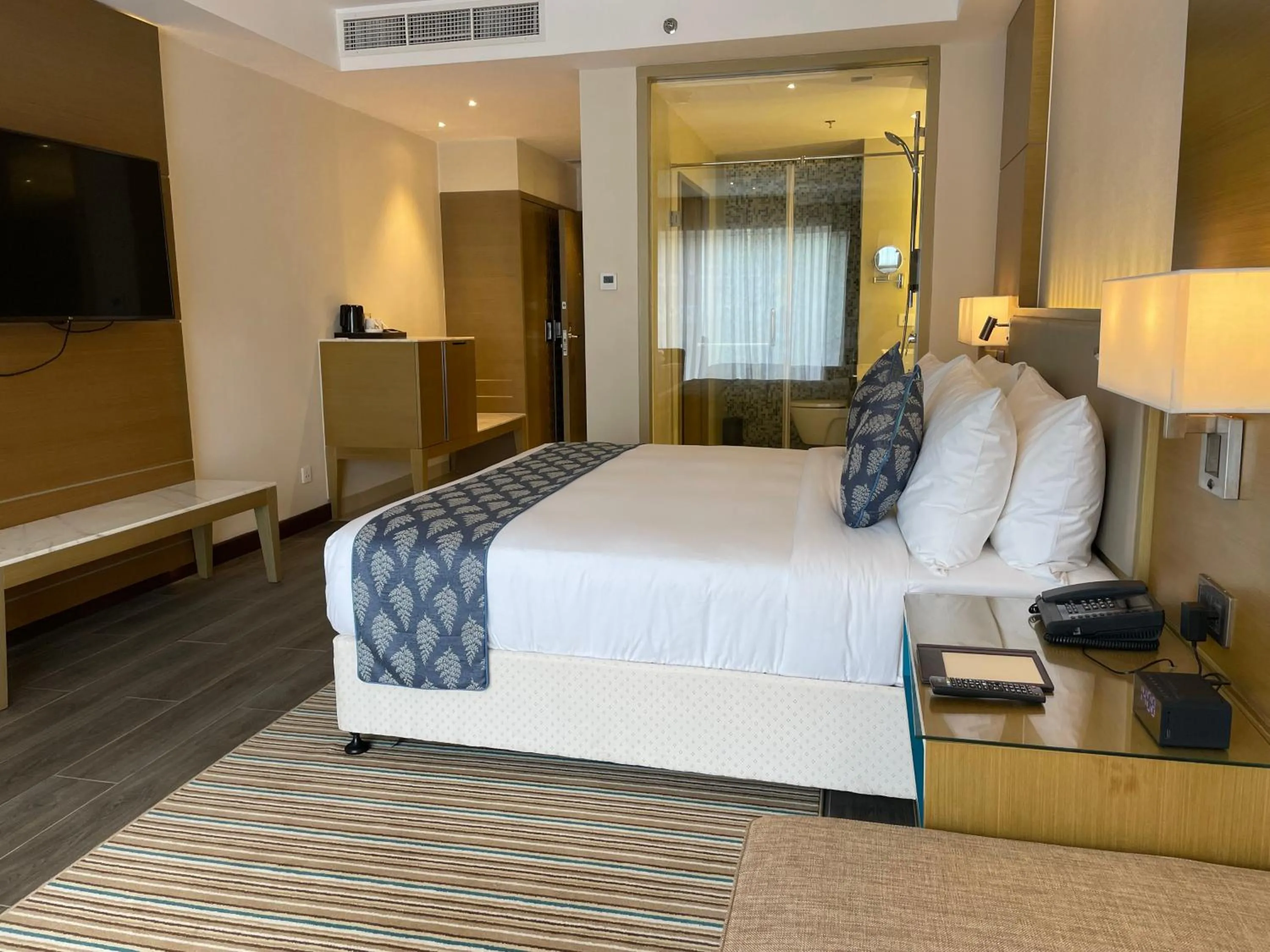 Bedroom, Bed in Gokulam Grand Trivandrum