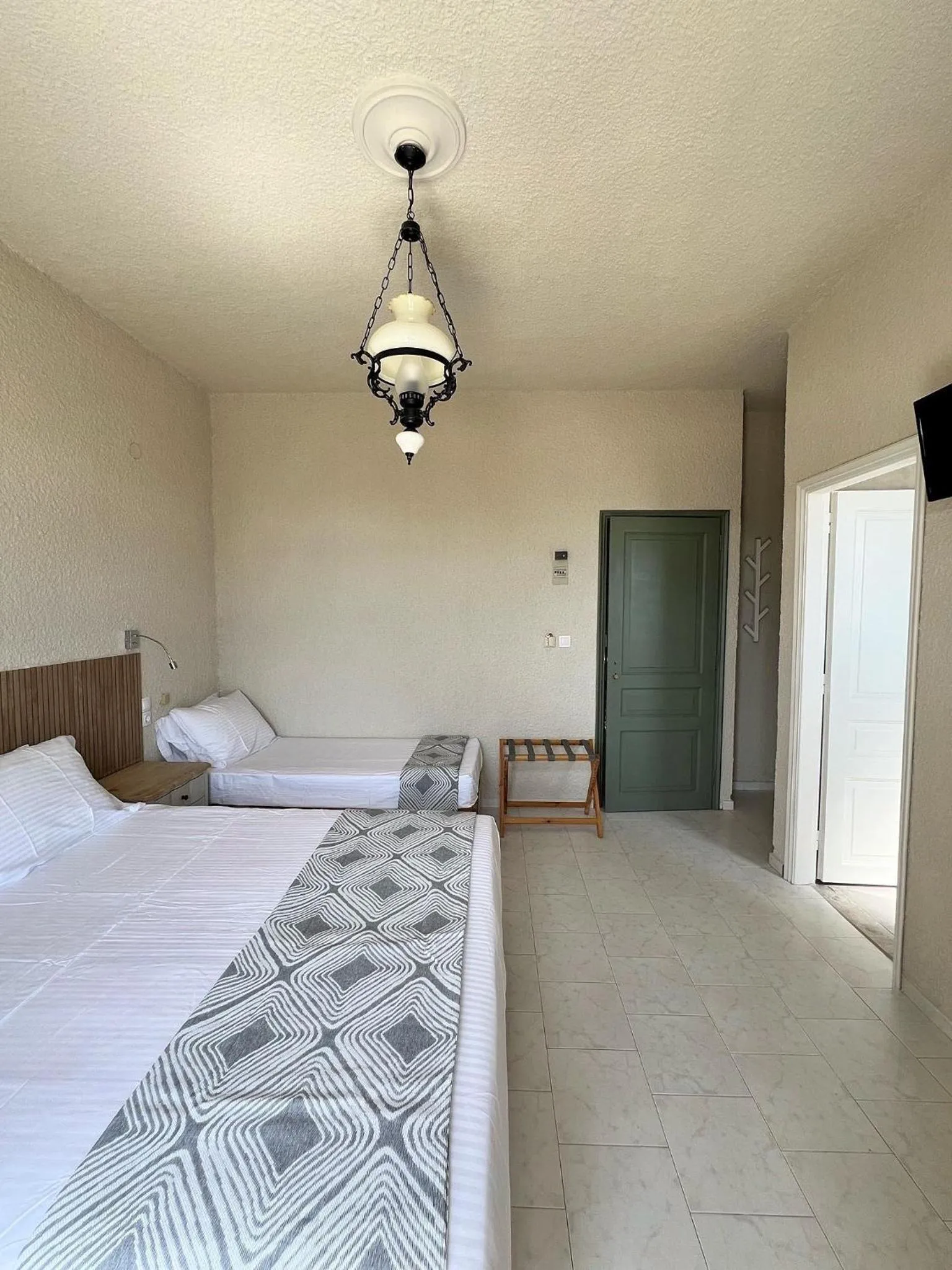 Photo of the whole room, Bed in Kores Aegina