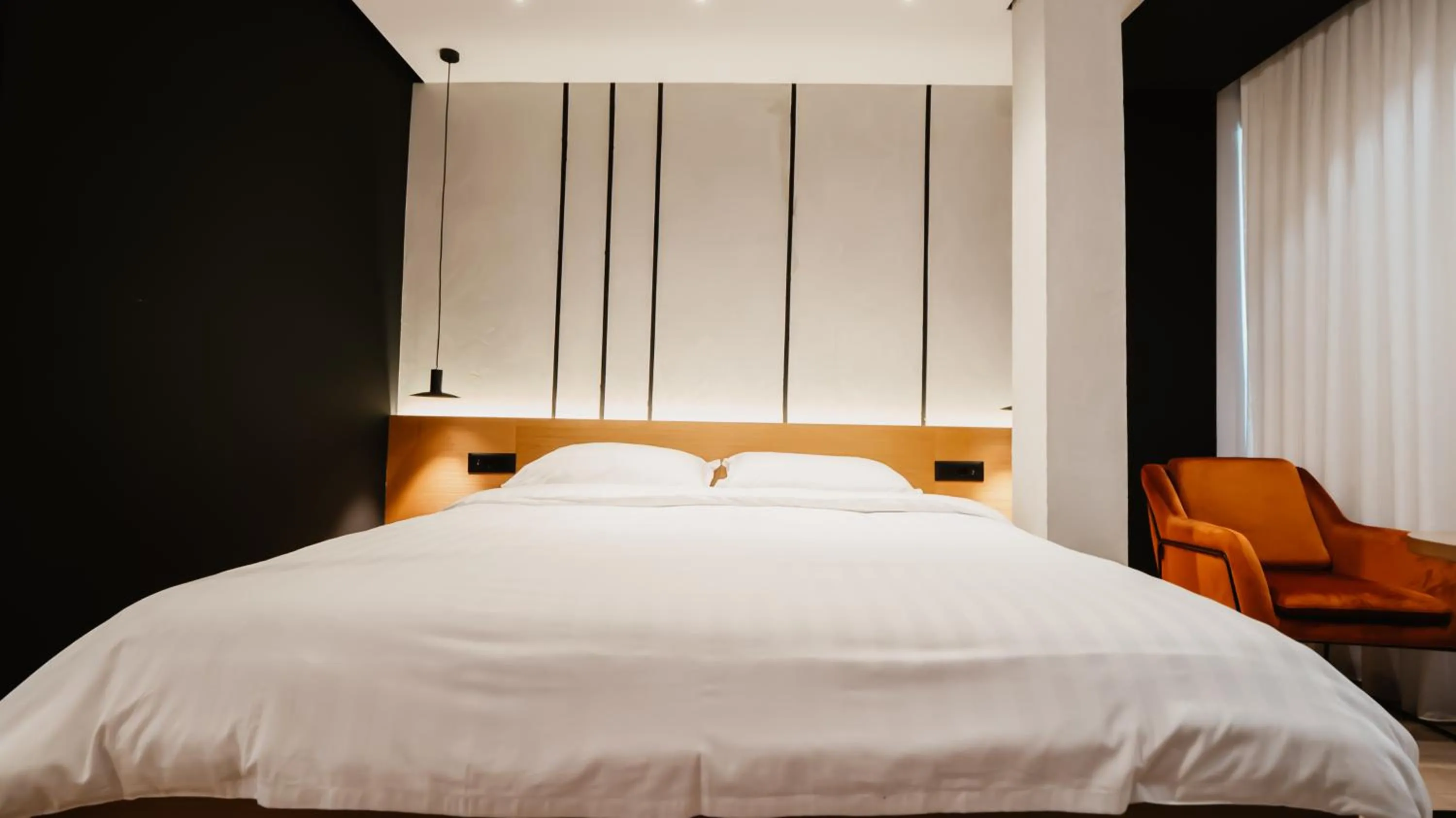 Bed in BAZ'HUR Boutique Hotel