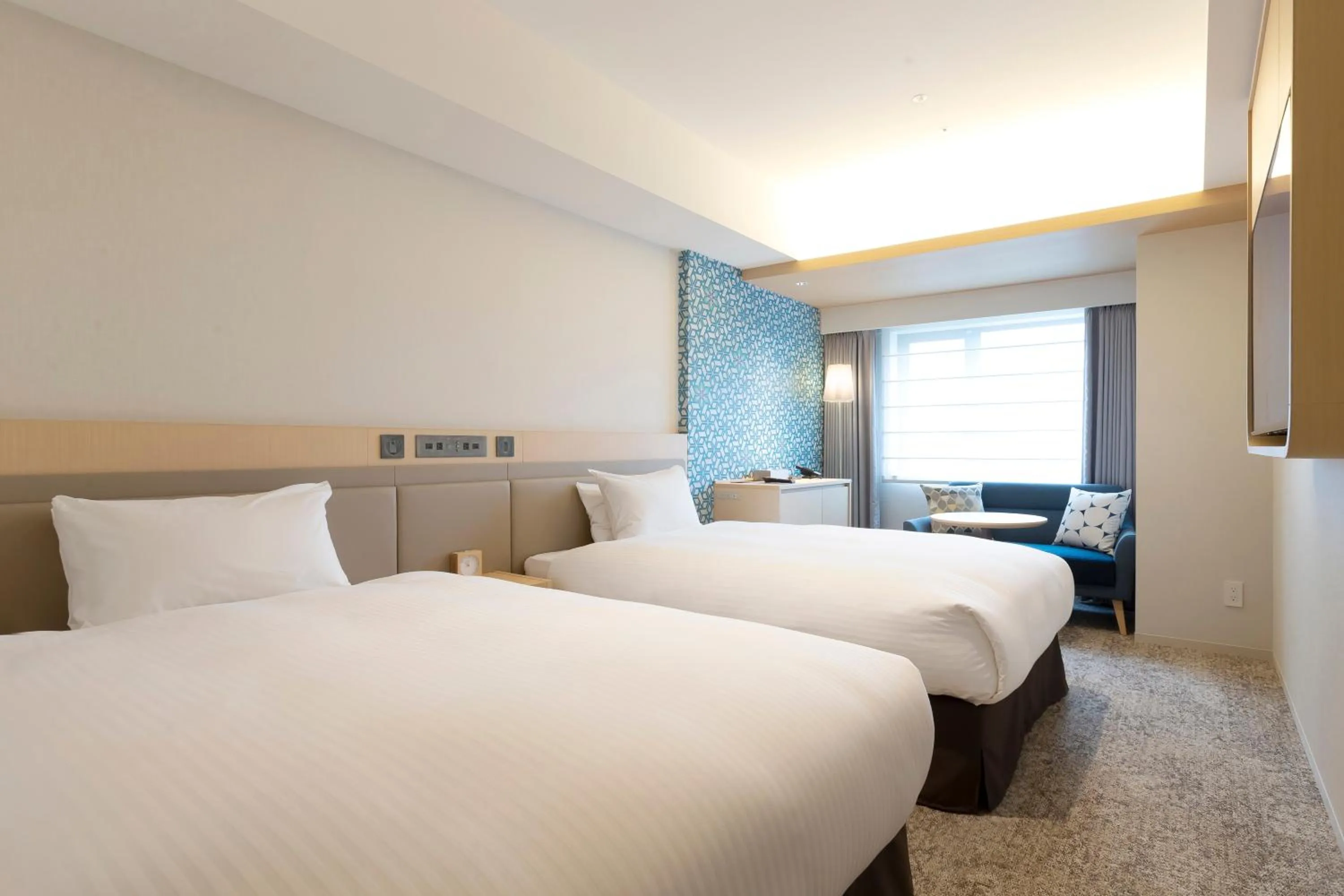 Bed in Hotel Emion Sapporo