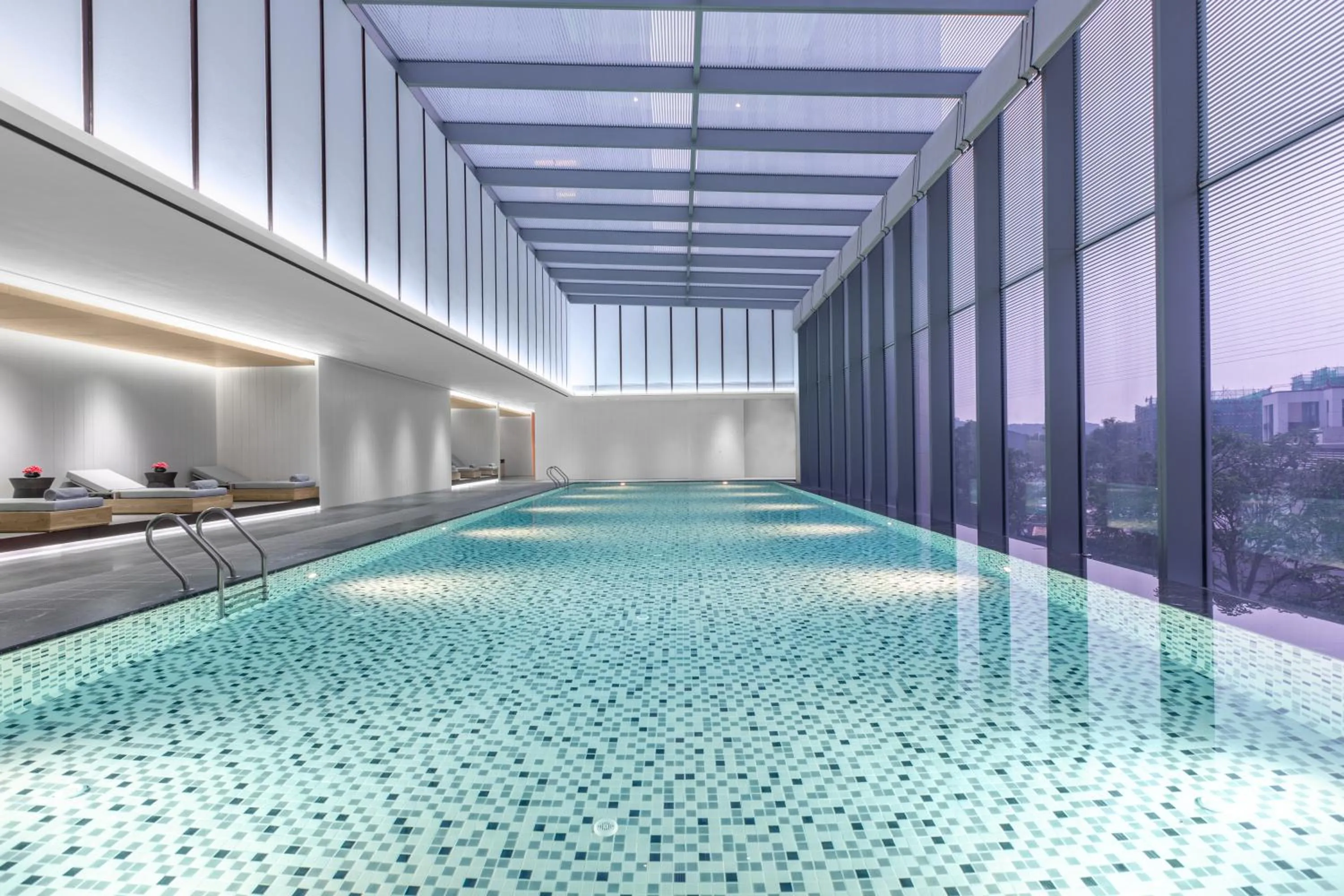 Swimming pool in Crowne Plaza Jiangmen Binjiang by IHG