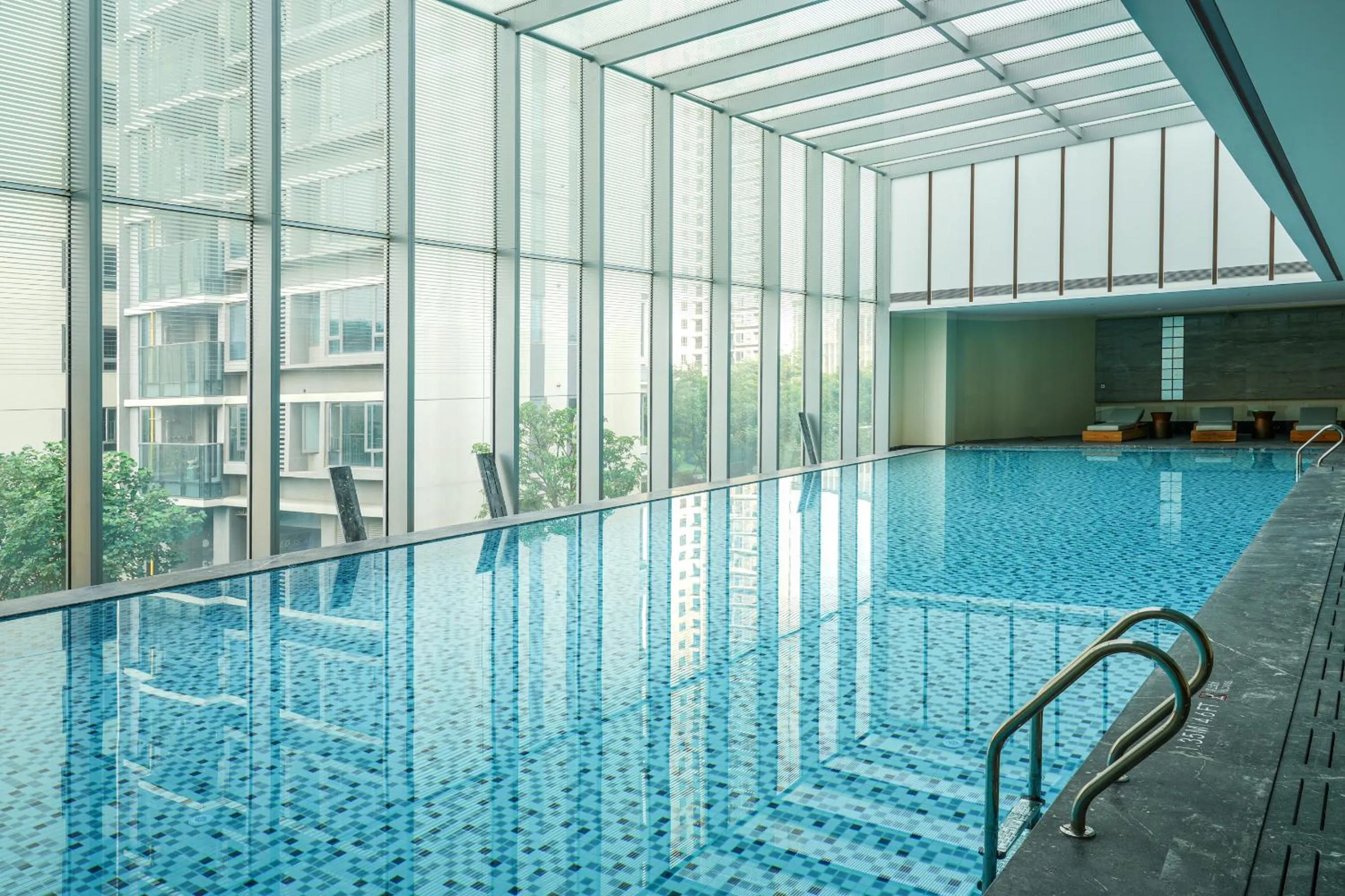 Swimming pool in Crowne Plaza Jiangmen Binjiang by IHG