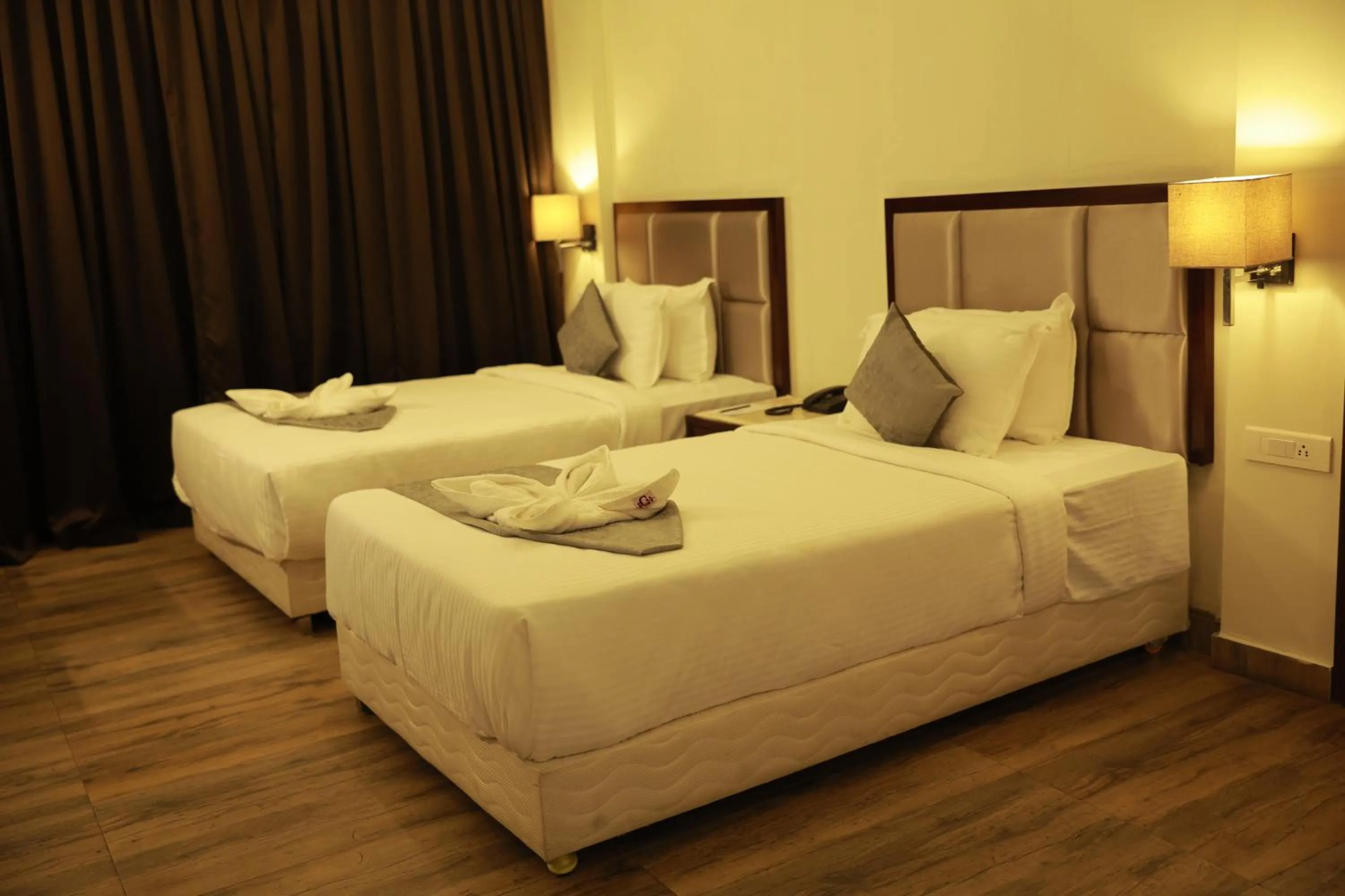 Bed in Paravoor Galaxy Hotel