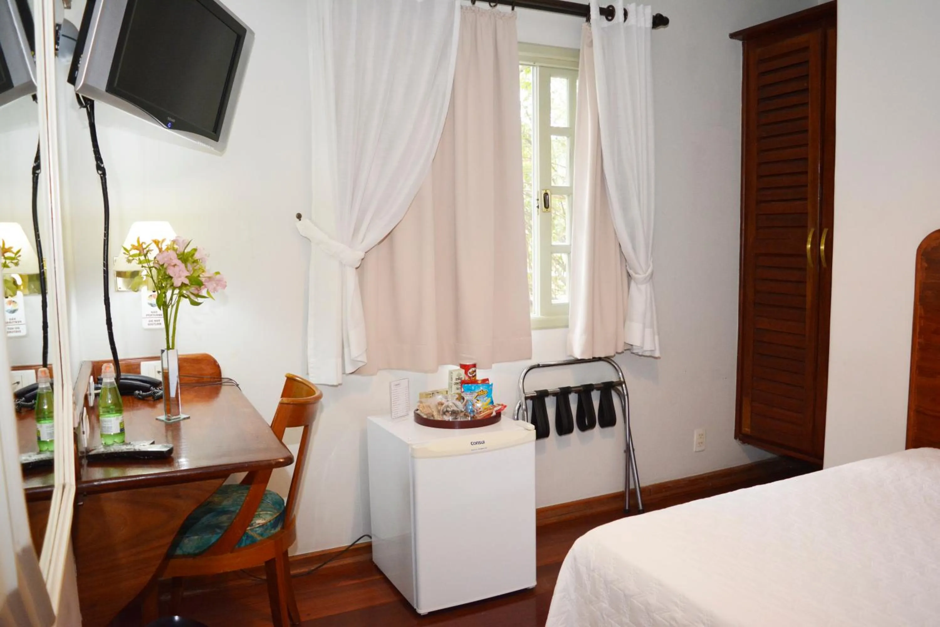 Bed in Pousada O Garimpo.