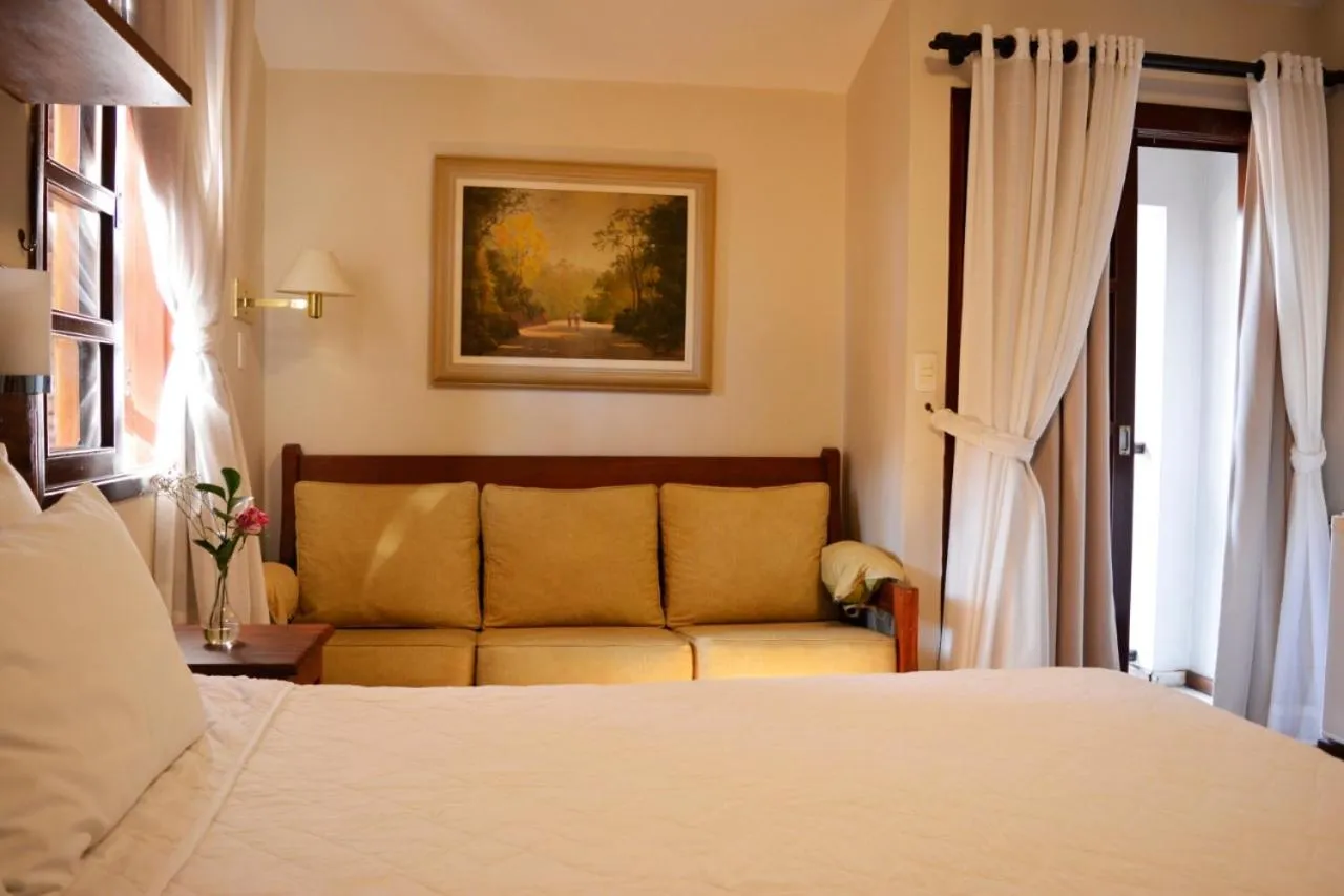 Bed in Pousada O Garimpo.