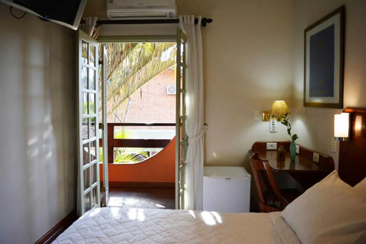 Bed in Pousada O Garimpo.