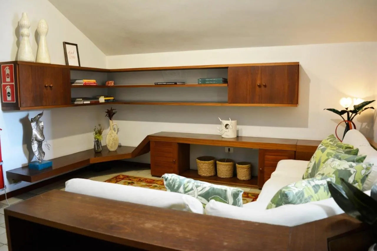 Communal lounge/ TV room, Bed in Pousada O Garimpo.