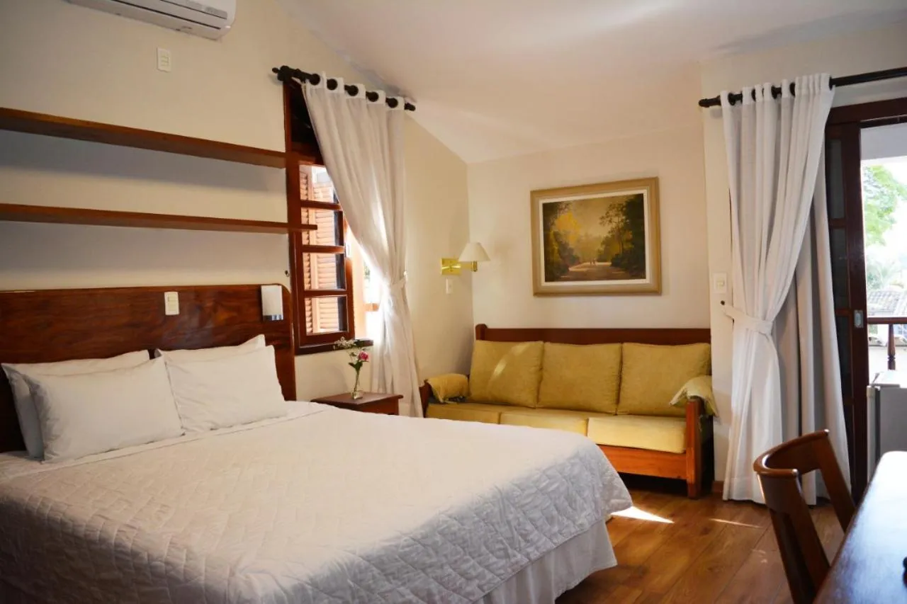 Bed in Pousada O Garimpo.